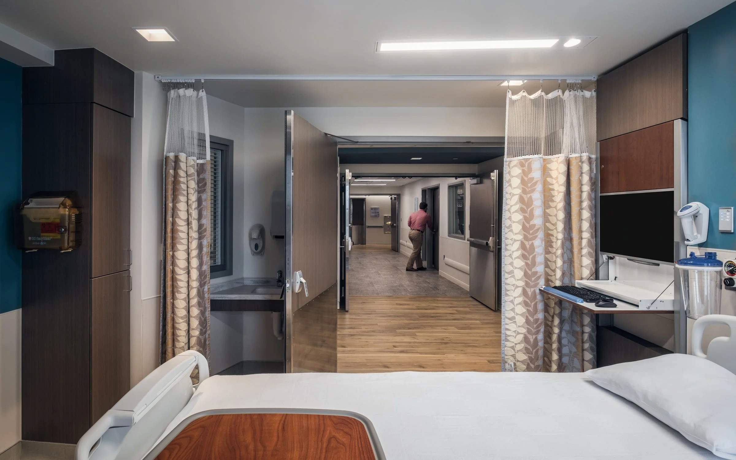Interior view of a patient room at Wayne Healthcare UNC, highlighting modern design and patient comfort.