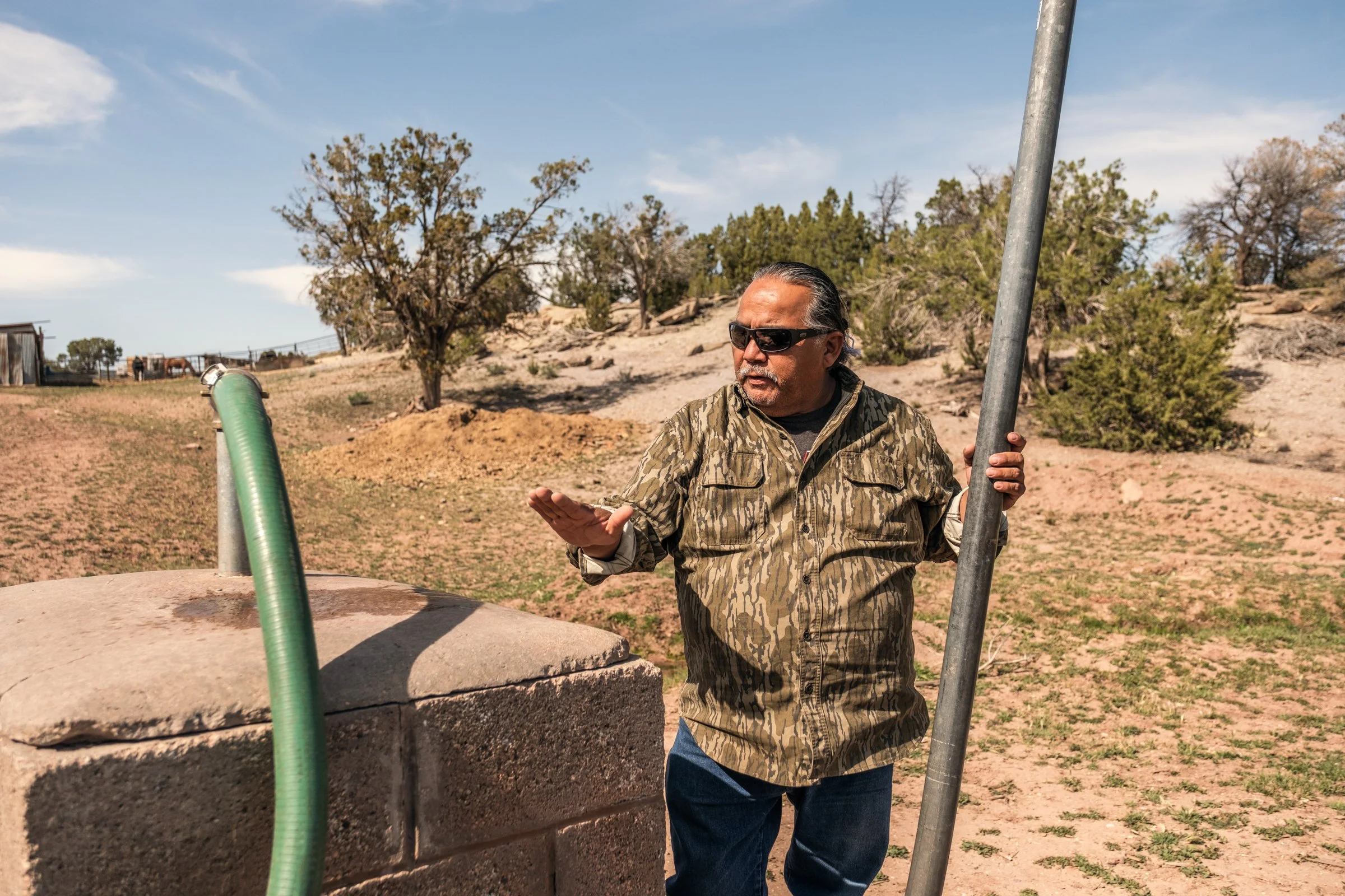 Hauling Life | Navajo Nation — Unified Metadata Paragraphs

Wayne Wilson and Joann Whiting collect water in Gallup, New Mexico at a community water source. The containers are filled, prepared, and loaded into their vehicle for transport across the Na
