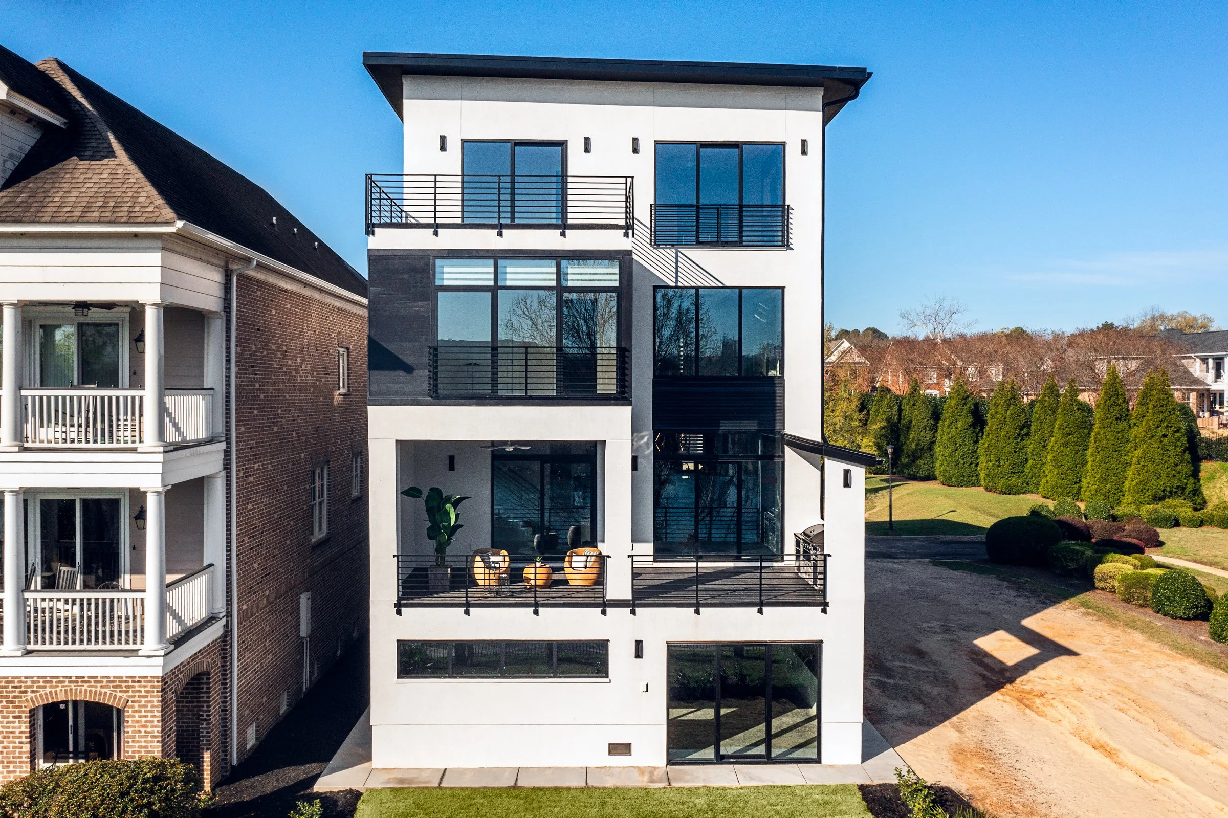 Architectural and interior photography of a customized lakefront home, highlighting design detail, atmosphere, infinity pool, and craftsmanship.