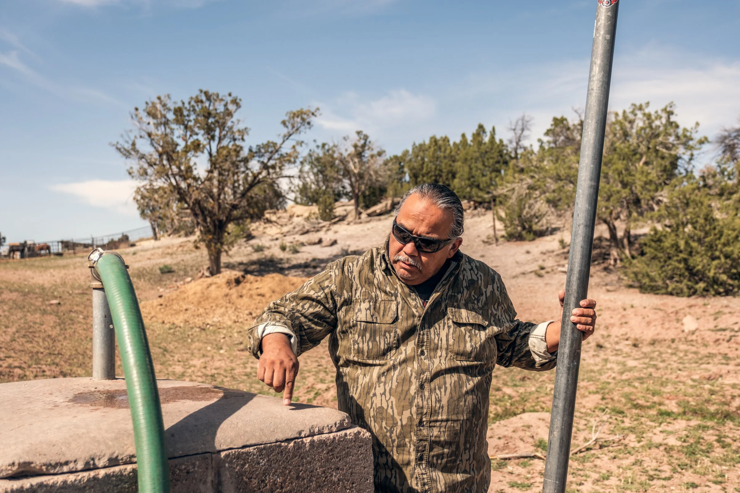 Hauling Life | Navajo Nation — Unified Metadata Paragraphs

Wayne Wilson and Joann Whiting collect water in Gallup, New Mexico at a community water source. The containers are filled, prepared, and loaded into their vehicle for transport across the Na