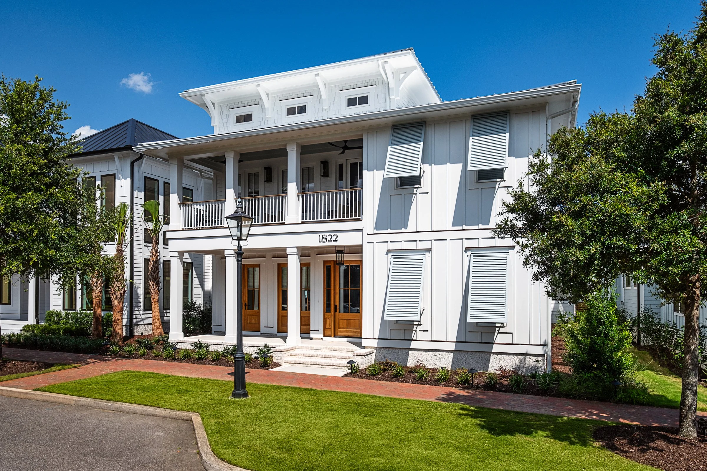 Dwelling Place Interiors luxury residential interior design project featuring a custom kitchen renovation, high-end cabinetry and millwork, detailed tilework, beautifully designed bathrooms, living spaces, bookshelves, and outdoor living areas, photo