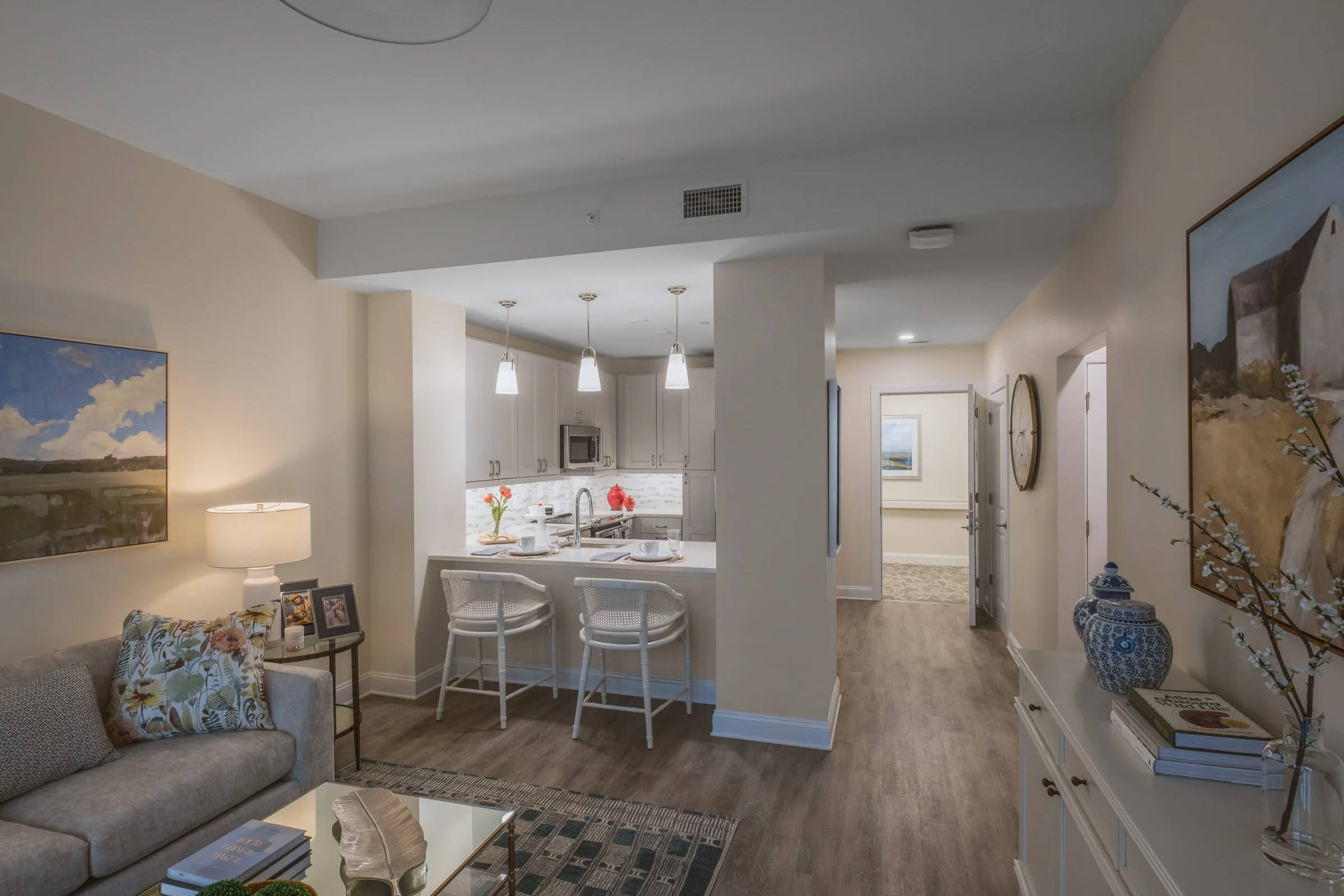 Open concept dining and entertainment space in Village on Morehead unit highlighting contemporary design elements