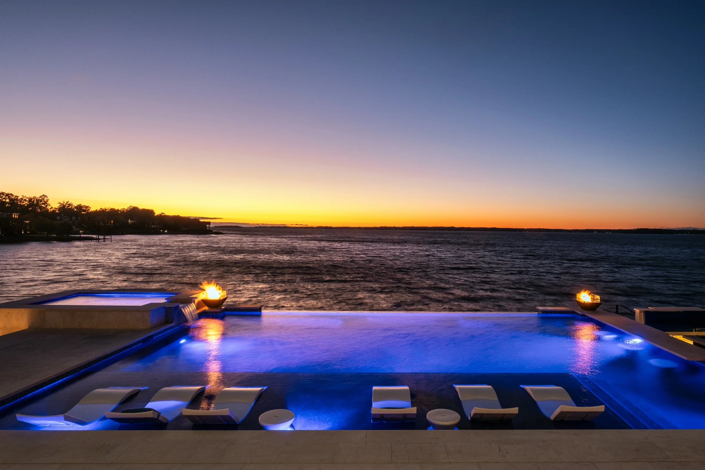Architectural and interior photography of a customized lakefront home, highlighting design detail, atmosphere, infinity pool, and craftsmanship.