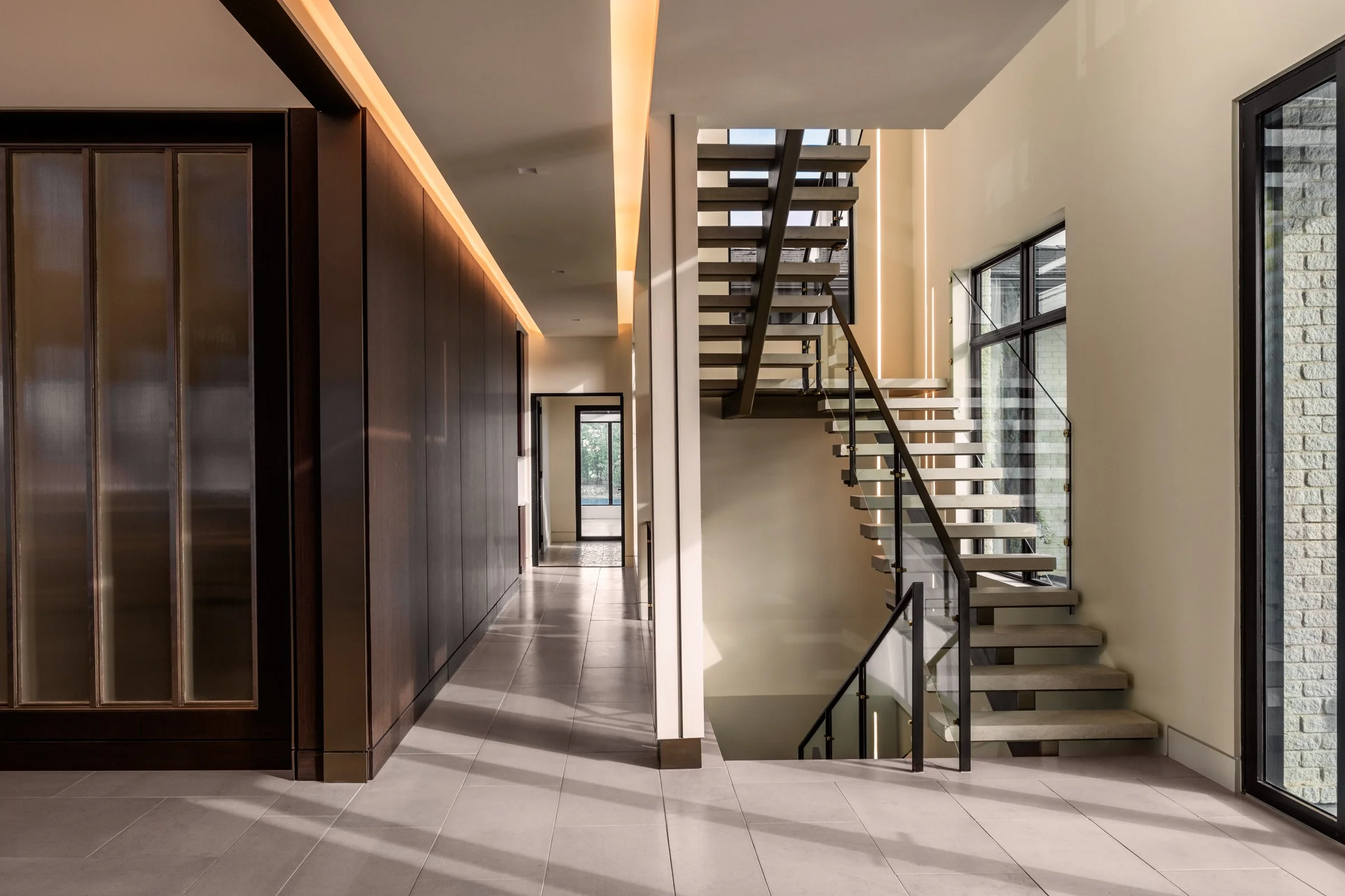 Architectural and interior photography of a customized lakefront home, highlighting design detail, atmosphere, infinity pool, and craftsmanship.