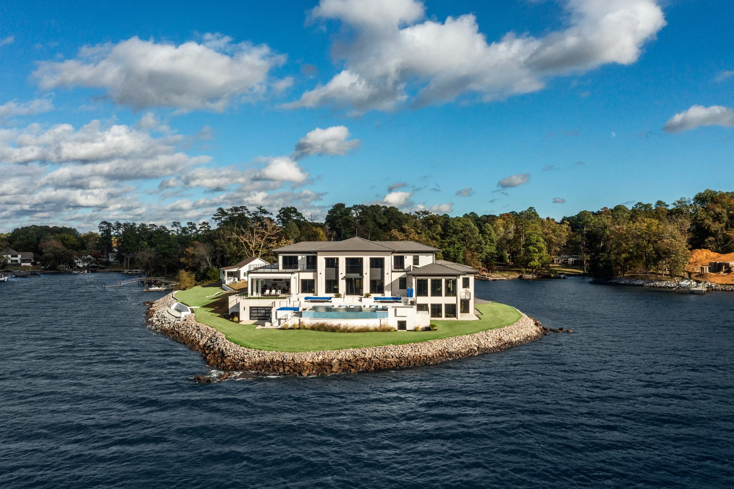 Architectural and interior photography of a customized lakefront home, highlighting design detail, atmosphere, infinity pool, and craftsmanship.