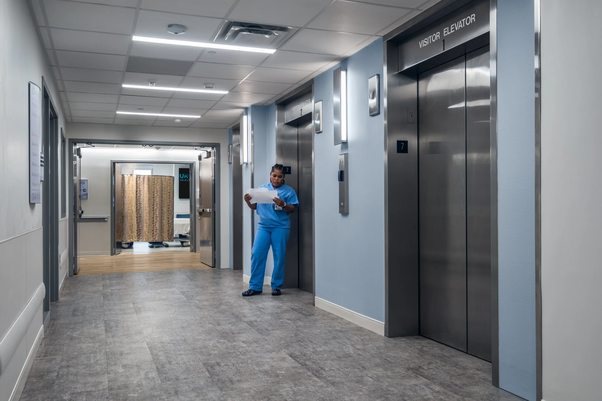Elevator hallway at Wayne Healthcare UNC, featuring advanced medical equipment and sterile environment.