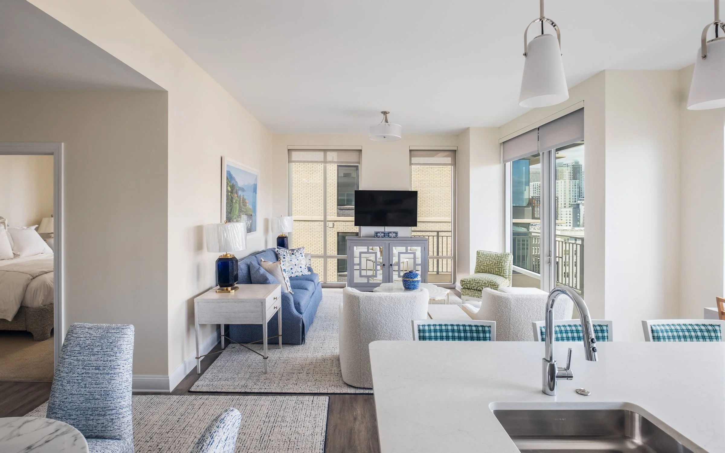 Open concept dining and entertainment space in Village on Morehead unit highlighting contemporary design elements