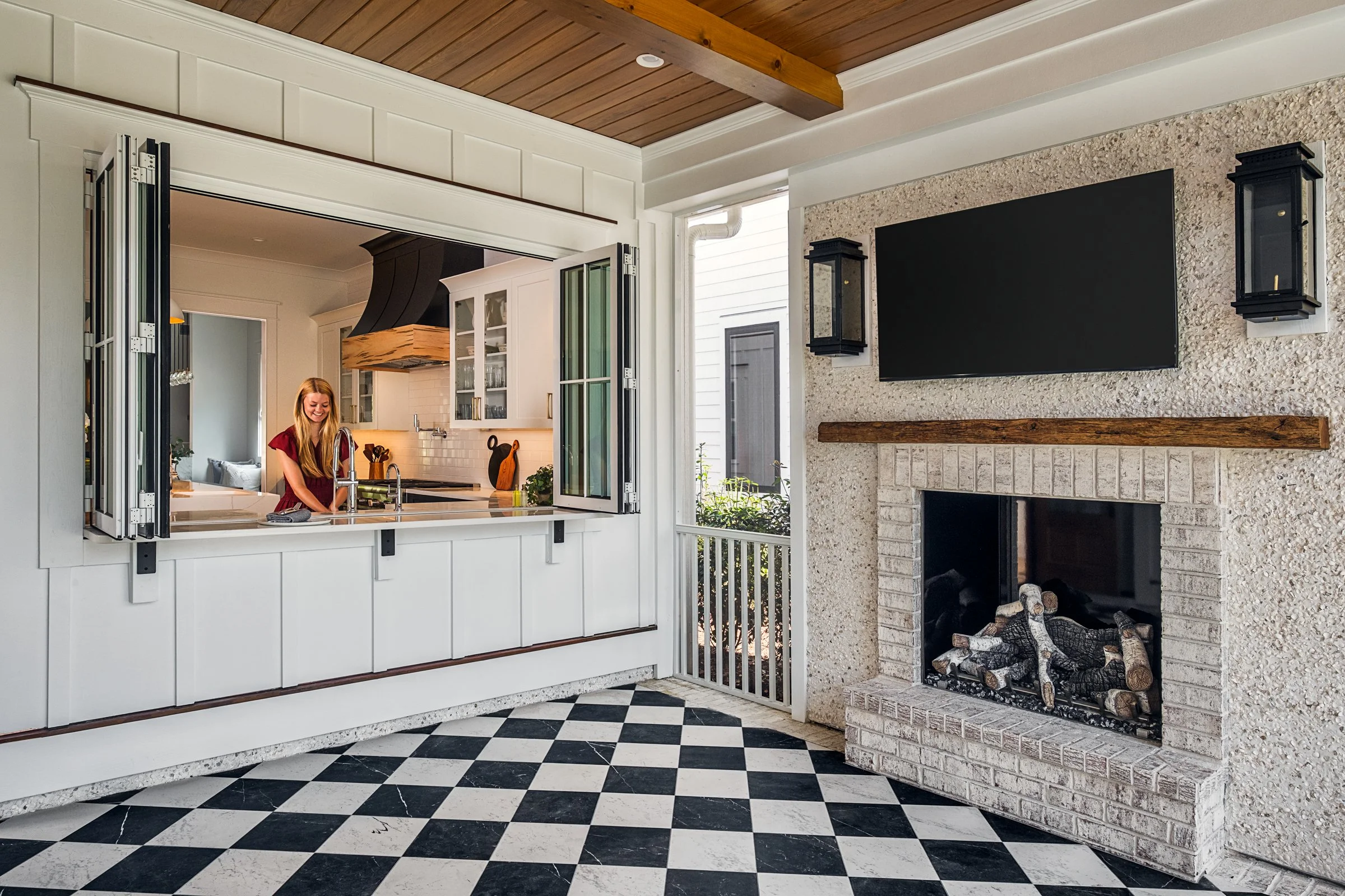 Dwelling Place Interiors luxury residential interior design project featuring a custom kitchen renovation, high-end cabinetry and millwork, detailed tilework, beautifully designed bathrooms, living spaces, bookshelves, and outdoor living areas, photo
