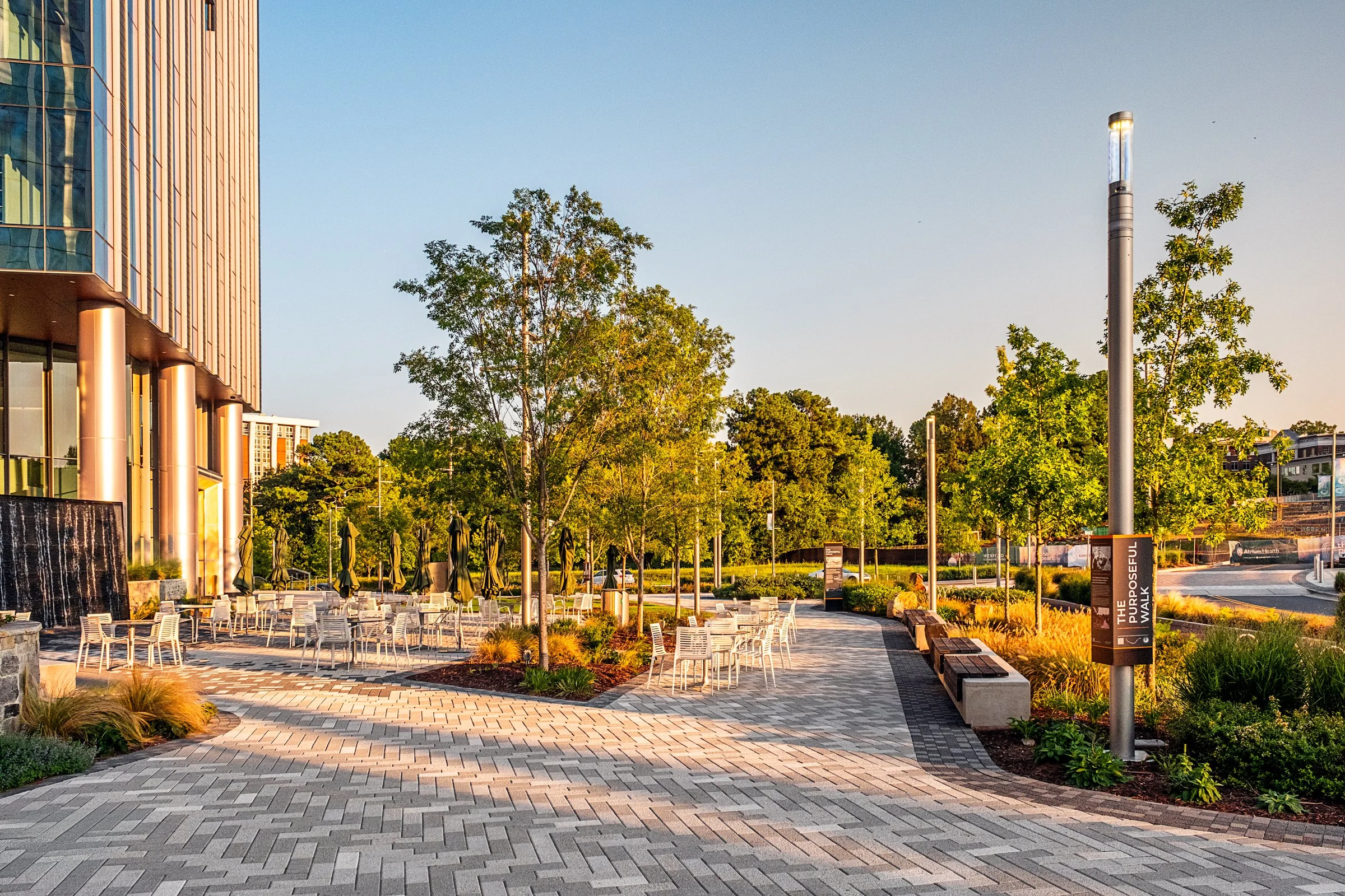 Landscape architecture photography of The Pearl in Charlotte, North Carolina, commissioned by Kimley-Horn and photographed by Paul Lange of Lange Photo Studio. The project features landscaped public spaces, a terraced central plaza, and the Purposefu