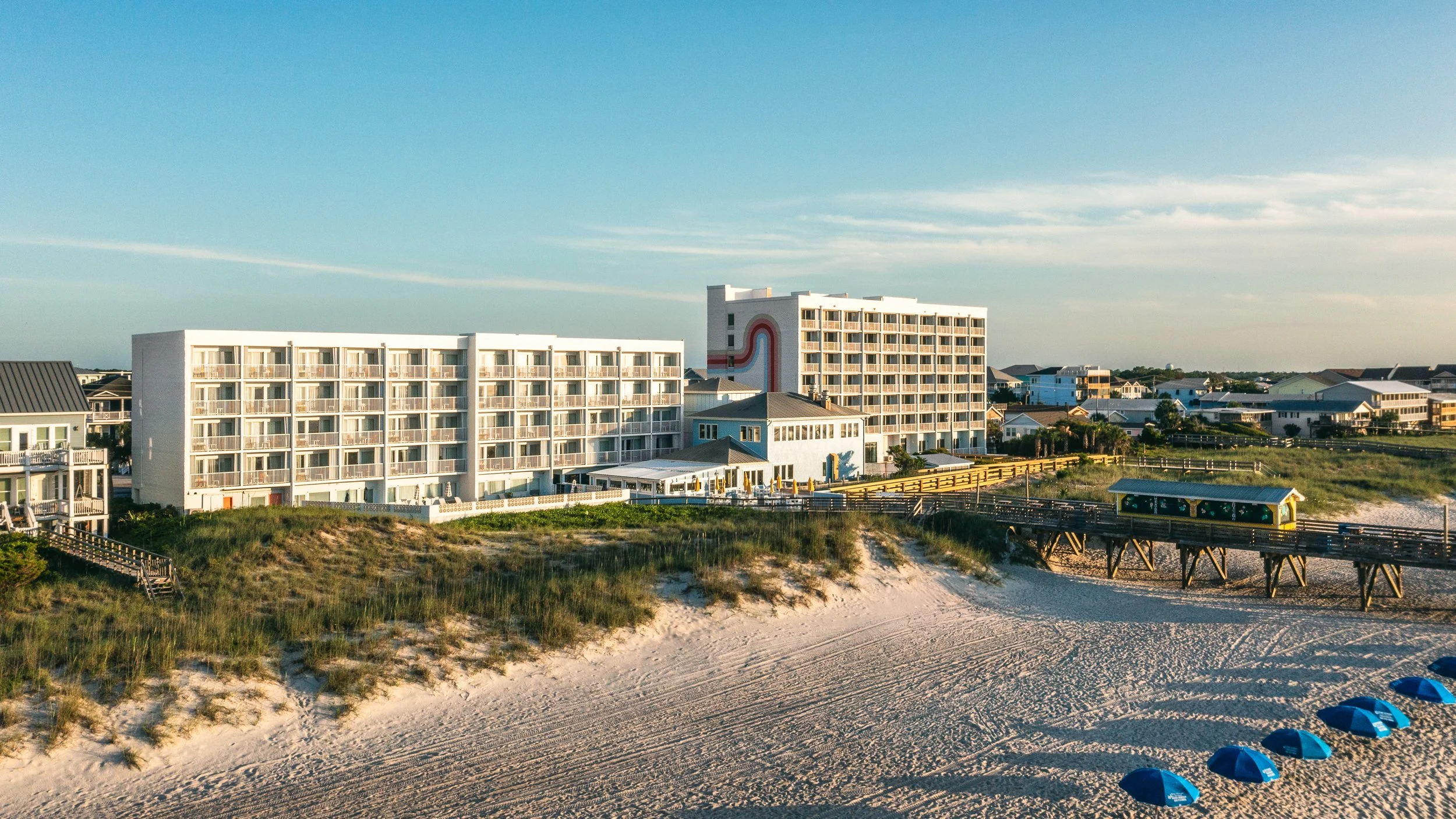 Aerial drone image of Golden Sands Hotel exterior and landscape, illustrating architectural context and property branding under Hilton standards.