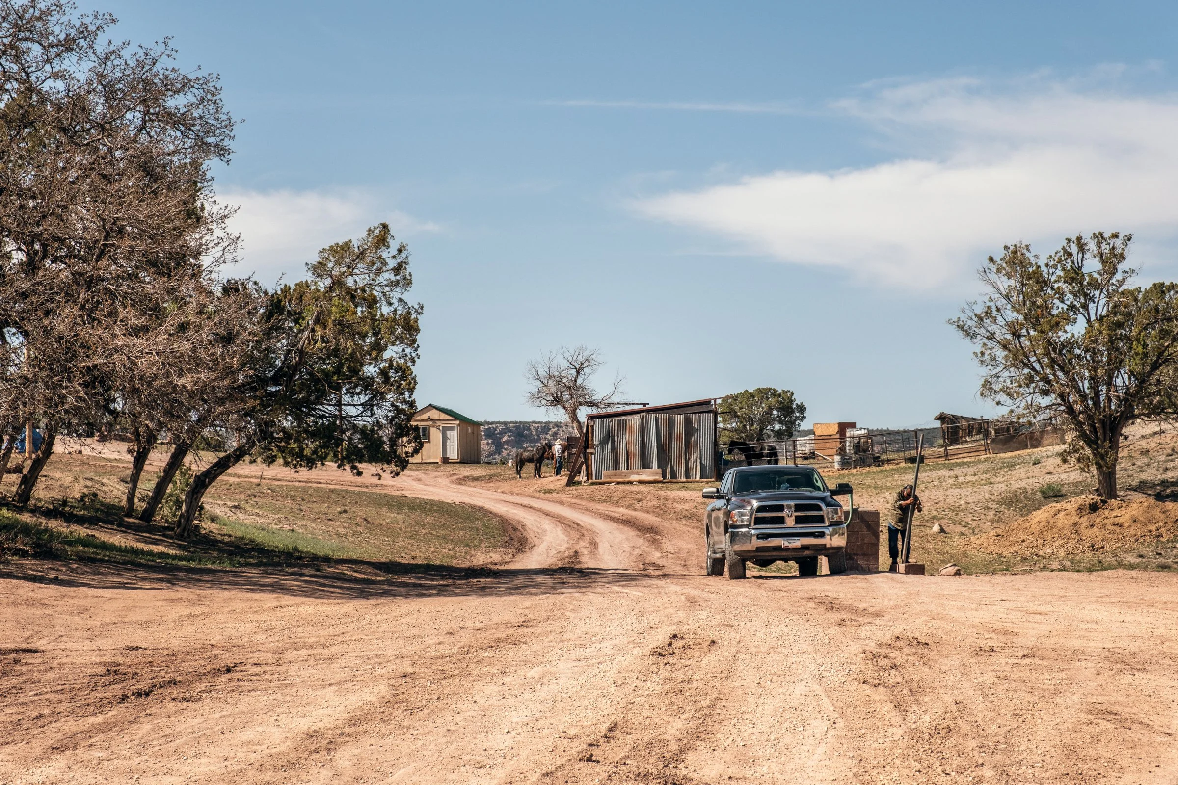 Hauling Life | Navajo Nation — Unified Metadata Paragraphs

Wayne Wilson and Joann Whiting collect water in Gallup, New Mexico at a community water source. The containers are filled, prepared, and loaded into their vehicle for transport across the Na