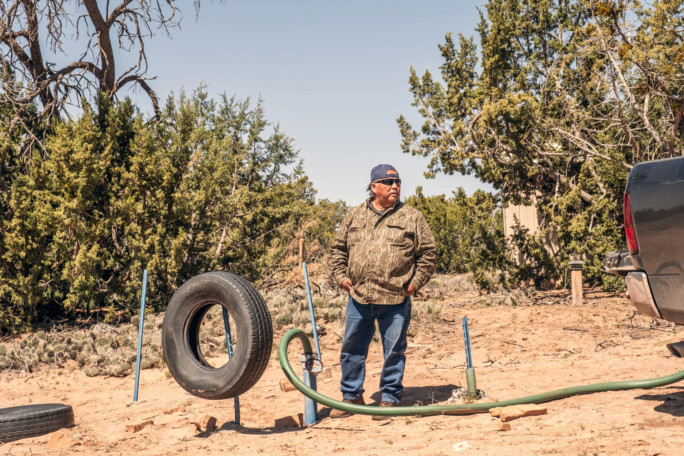 Hauling Life | Navajo Nation — Unified Metadata Paragraphs

Wayne Wilson and Joann Whiting collect water in Gallup, New Mexico at a community water source. The containers are filled, prepared, and loaded into their vehicle for transport across the Na