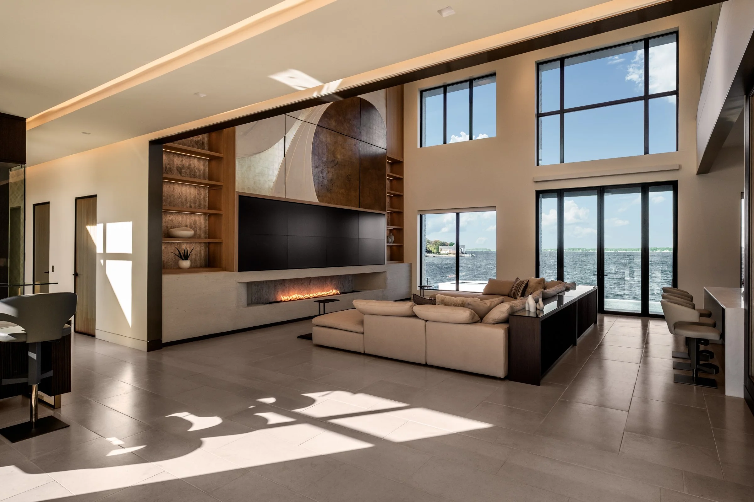 Architectural and interior photography of a customized lakefront home, highlighting design detail, atmosphere, infinity pool, and craftsmanship.