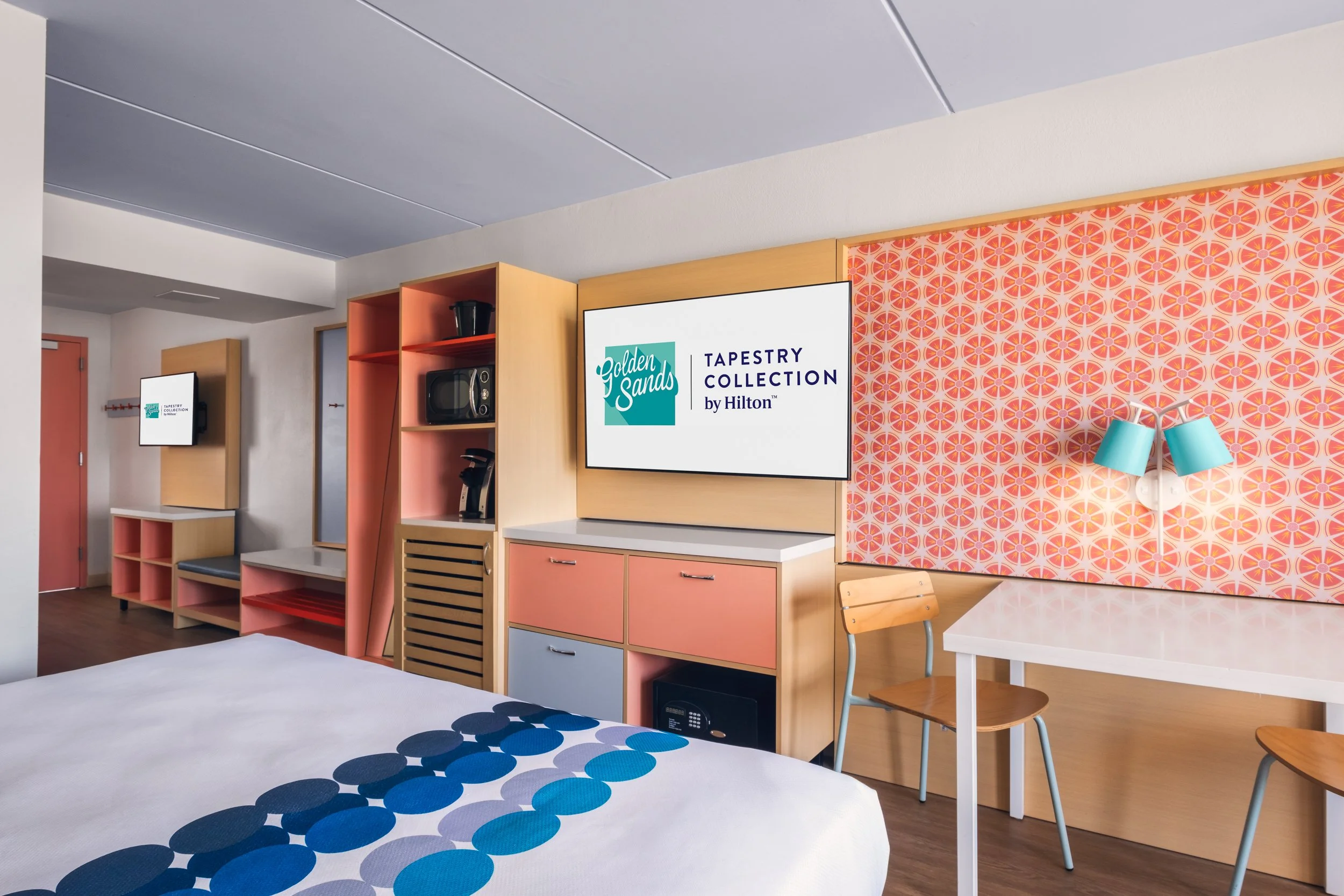 Warm hospitality photography of guest room at Golden Sands Hotel, showing thoughtful composition, branded consistency, and uncluttered guest environment.