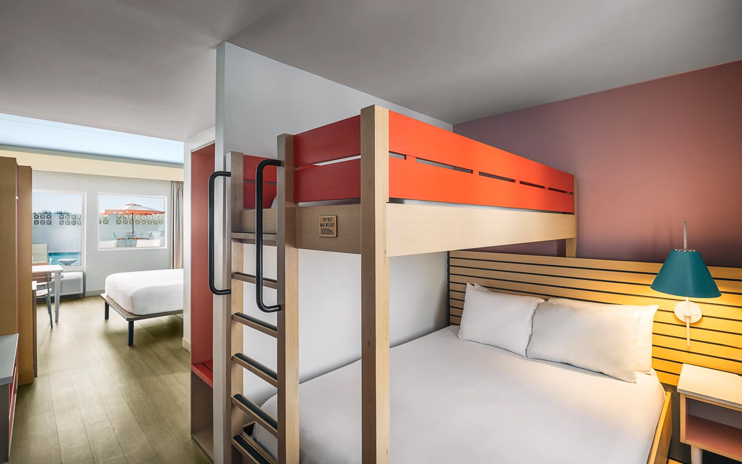 Warm hospitality photography of guest room at Golden Sands Hotel, showing thoughtful composition, branded consistency, and uncluttered guest environment.