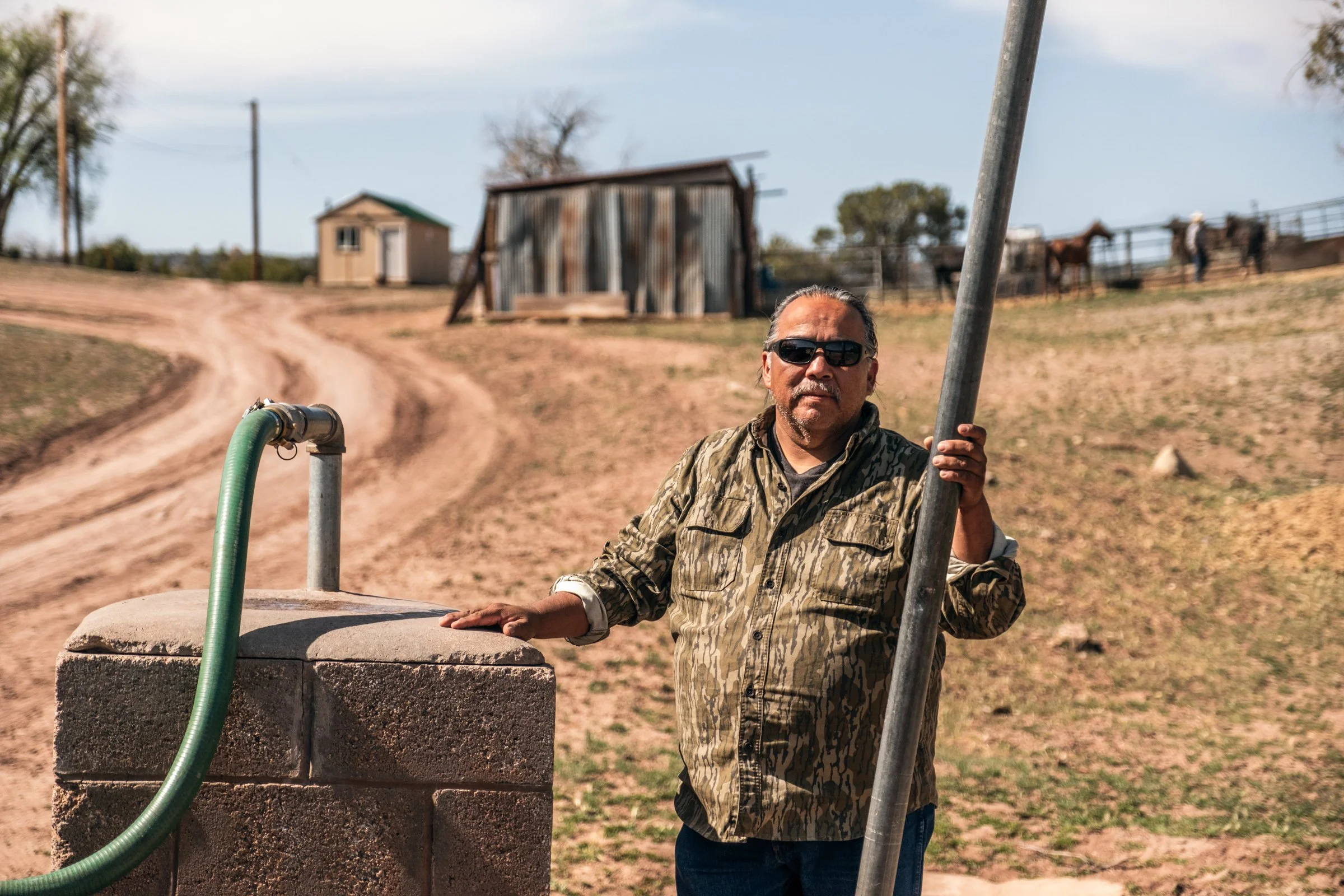 Hauling Life | Navajo Nation — Unified Metadata Paragraphs

Wayne Wilson and Joann Whiting collect water in Gallup, New Mexico at a community water source. The containers are filled, prepared, and loaded into their vehicle for transport across the Na