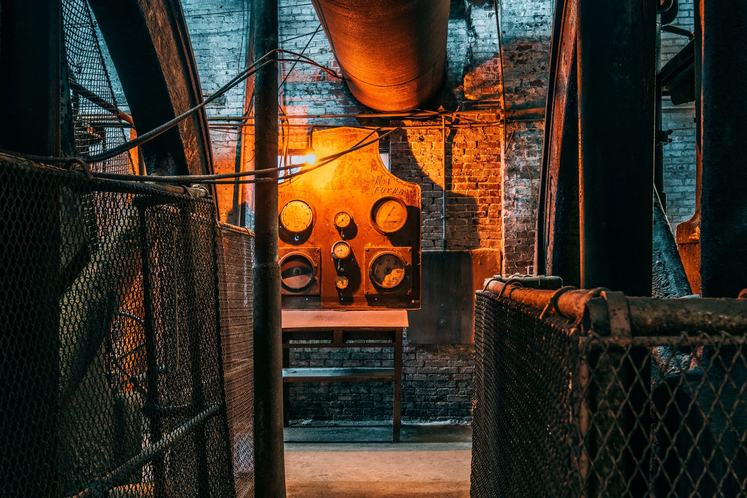 Sloss Furnaces, Birmingham, Alabama. Once the heart of the South's iron industry, these blast furnaces operated from 1882 to 1971, shaping Birmingham's identity as an industrial center. Now preserved as a National Historic Landmark, the site stands a