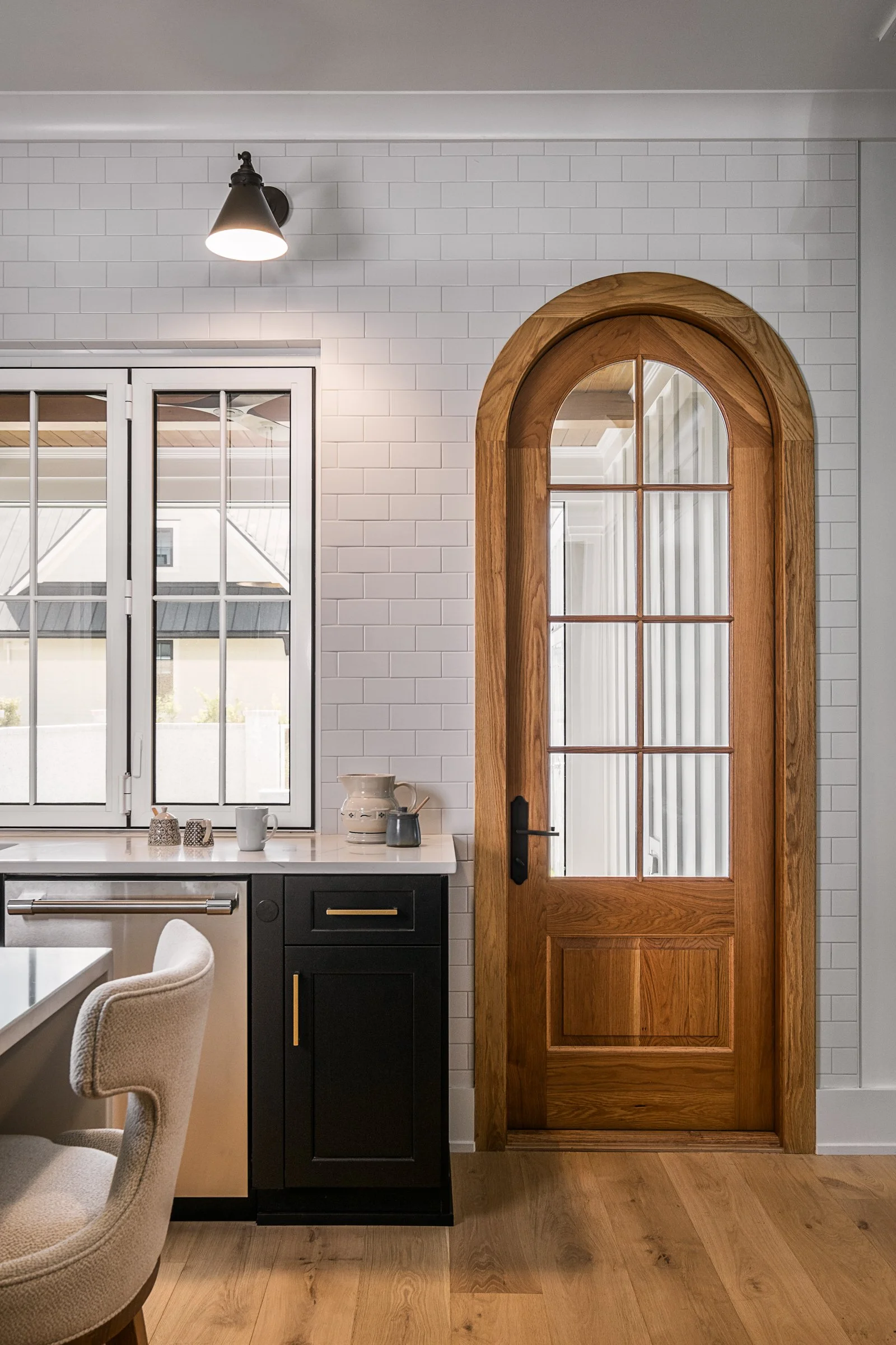 Dwelling Place Interiors luxury residential interior design project featuring a custom kitchen renovation, high-end cabinetry and millwork, detailed tilework, beautifully designed bathrooms, living spaces, bookshelves, and outdoor living areas, photo