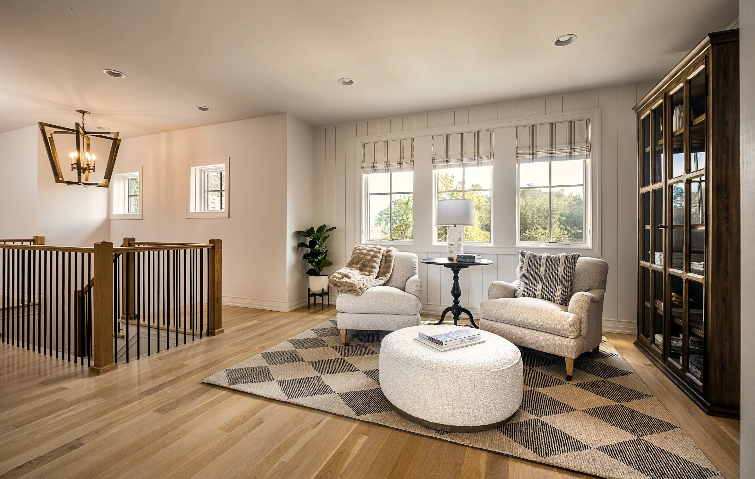 Architectural and interior photography of a custom home in Nashville, Tennessee, designed by Origin Architecture and photographed by Paul Lange of Lange Photo Studio. Warm light from the home’s fixtures highlights thoughtful architectural details and