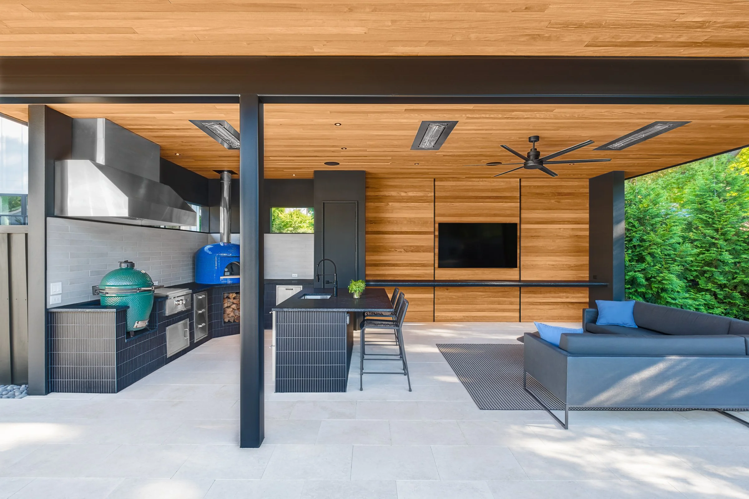 Modern pool pavilion architecture featuring clean lines, natural materials, and seamless indoor-outdoor living spaces in Charlotte, North Carolina. This contemporary structure showcases floor-to-ceiling glass walls, exposed wooden beams, and a minima