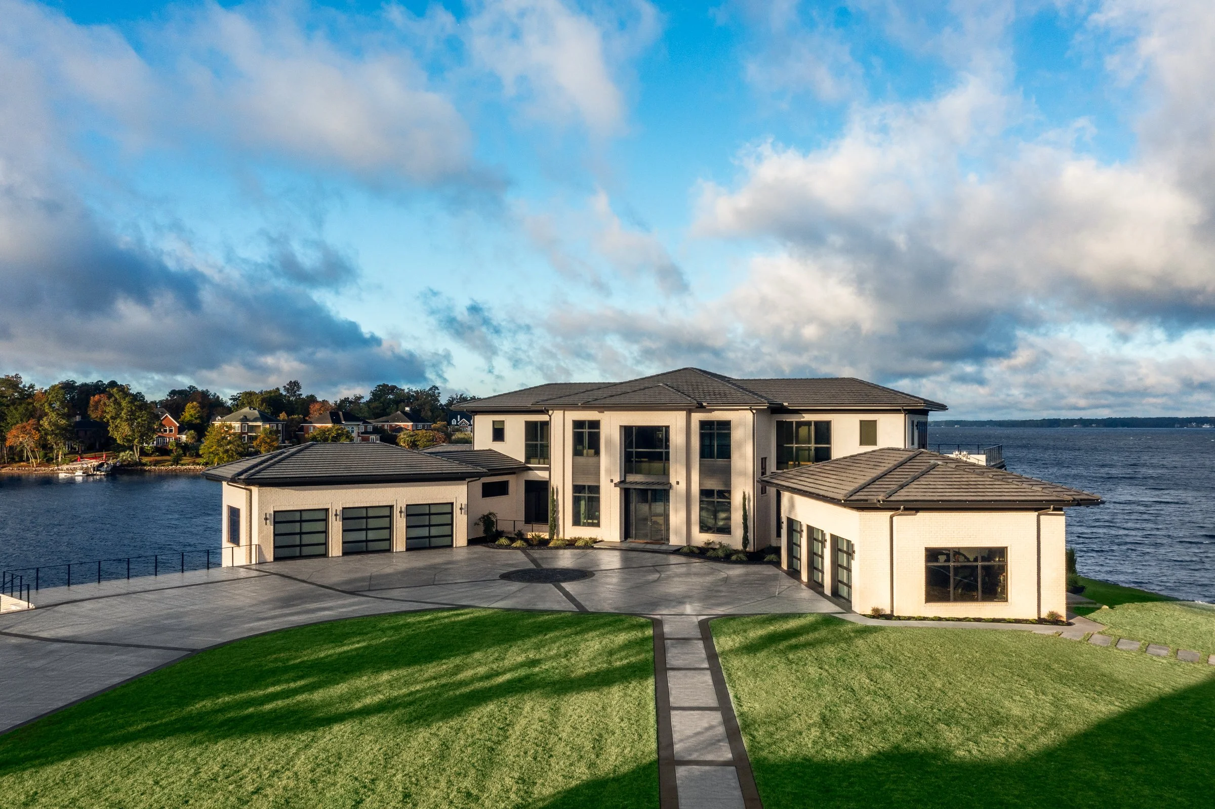 Architectural and interior photography of a customized lakefront home, highlighting design detail, atmosphere, infinity pool, and craftsmanship.