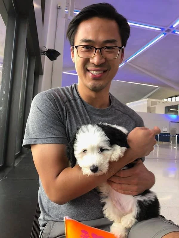 customer with new pet fluffy puppy