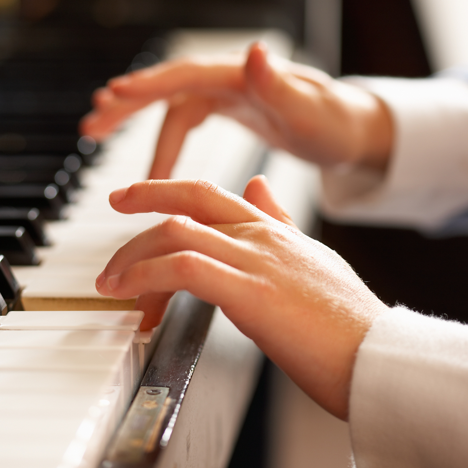 small hands playing the piano