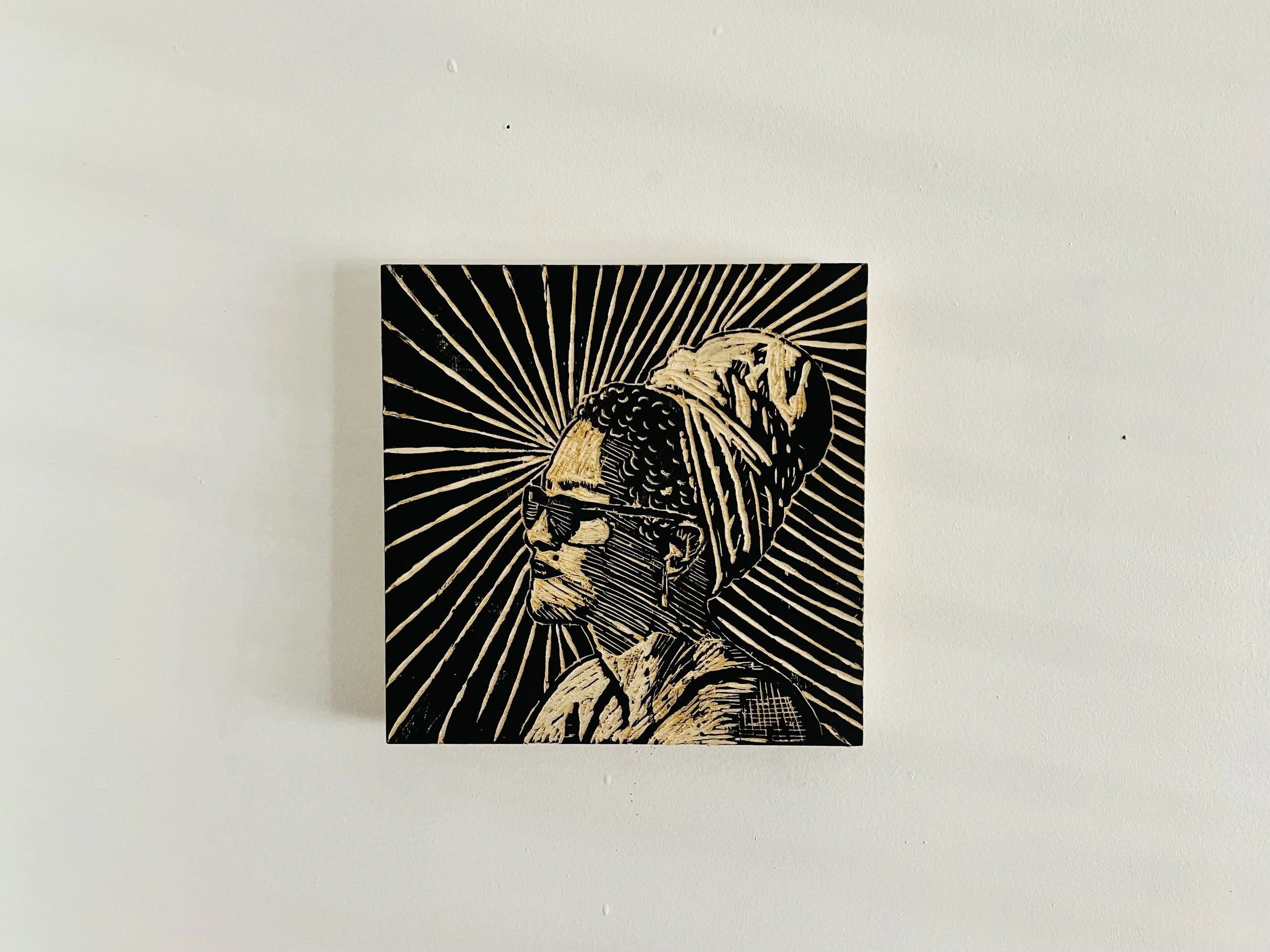 IN-LAW​
This particular artwork is meant to capture the sun-warmth as it glistens against the individuals' faces, which is described by the carved outlines. As she remains tranquil reflecting, gazing out into the world, she herself is returning the l