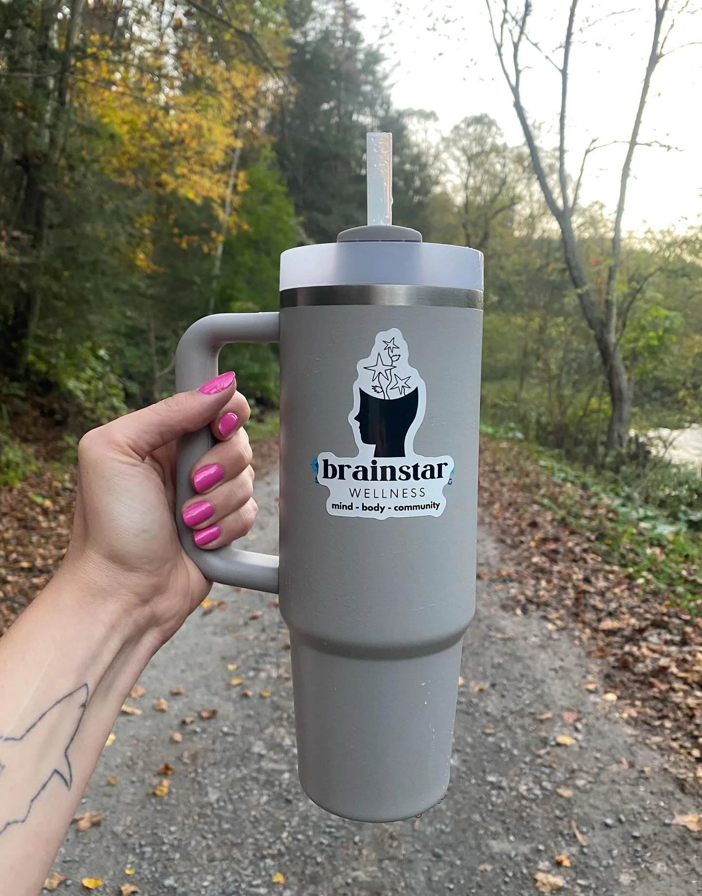 Repping Brainstar on the trail! 🧠⭐️ Perfect evening for a hike along the river.🌲🍂