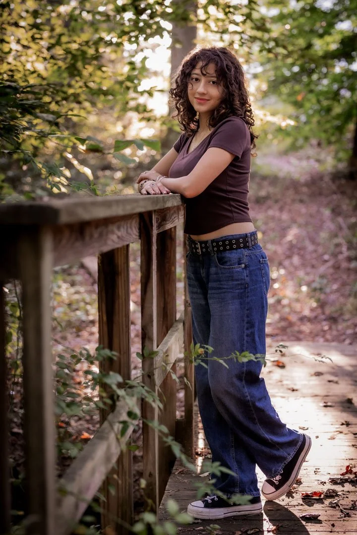 Senior on location teenager standing on bridge backlighting