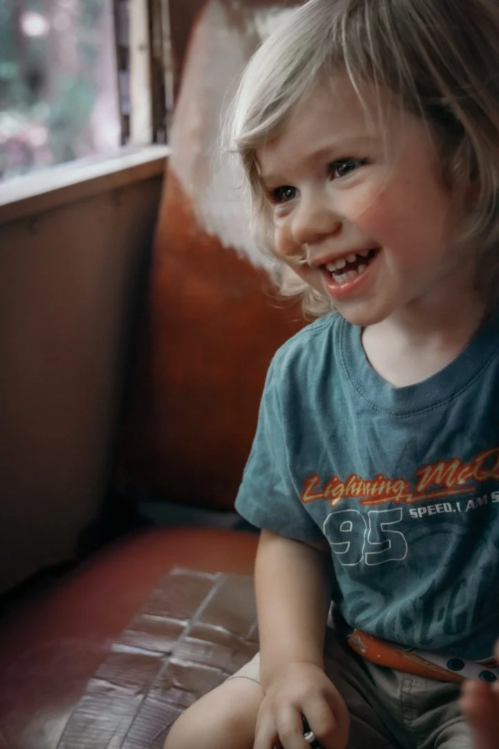 smiling toddler laughing for pictures