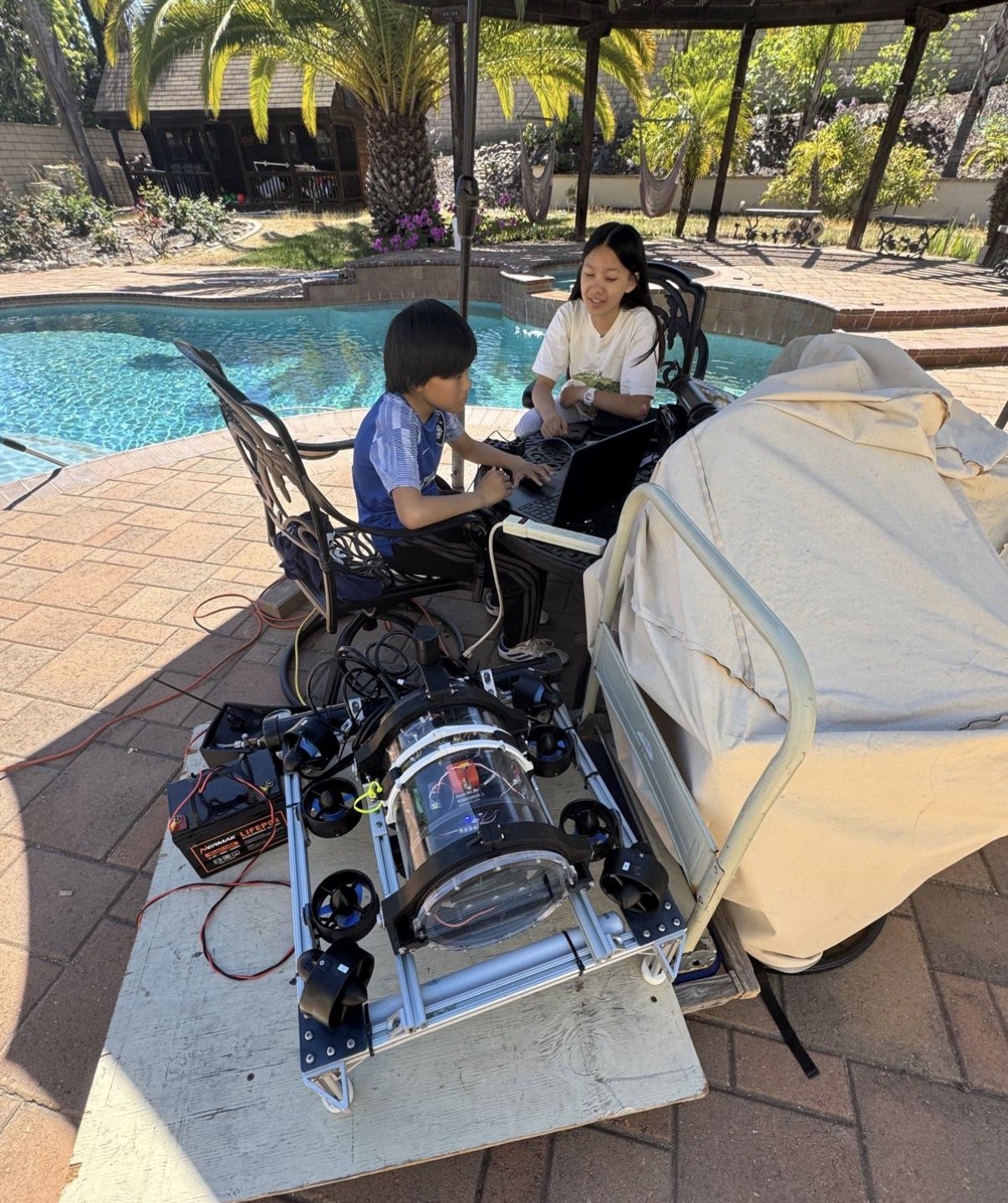 Team members conduct pool test of UUV software.