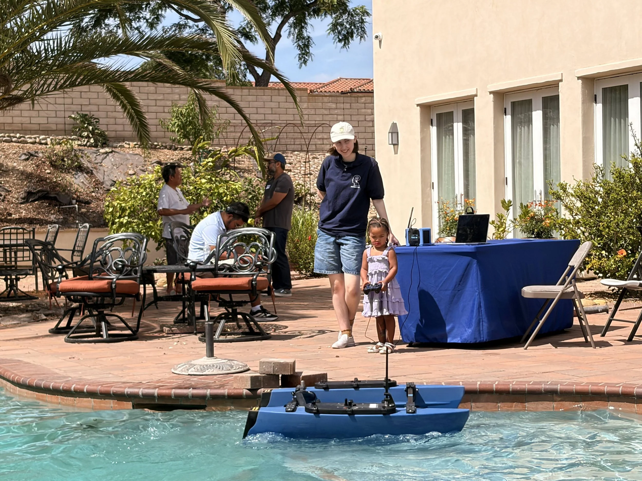 student controlling blue boat