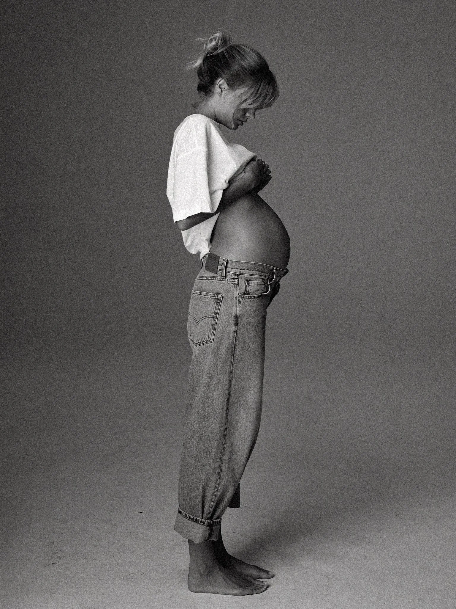 Mothers Day - Pregnant woman in white tee and jeans_ profile view - TVS.jpg