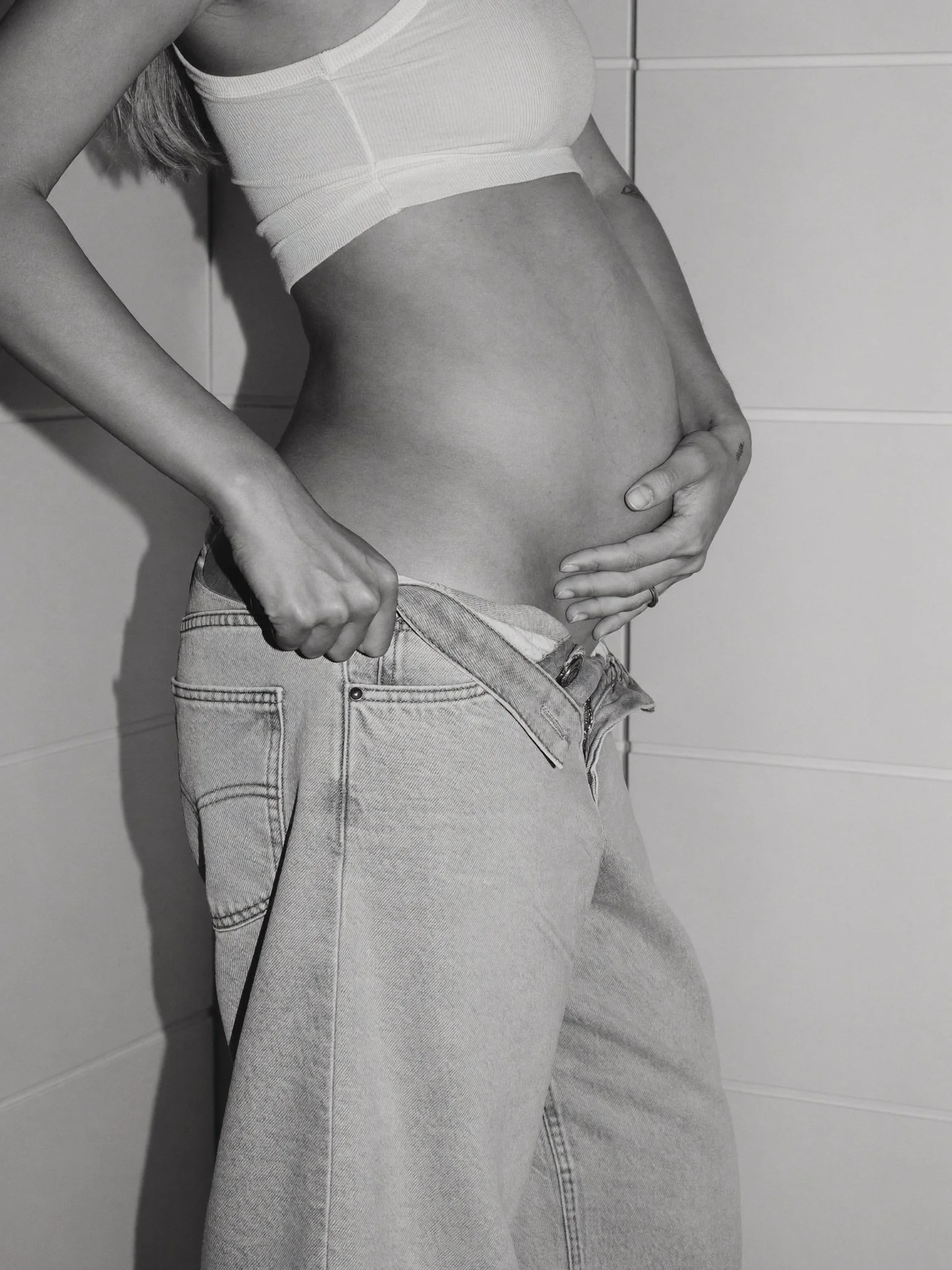 Mothers Day - Pregnant woman cradling belly in black and white portrait - TVS.jpg