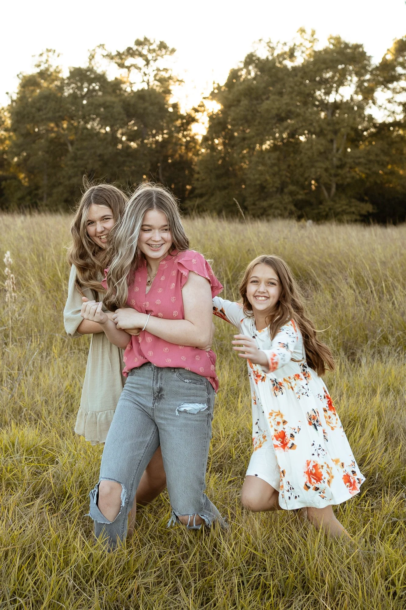 three sisters playing tag