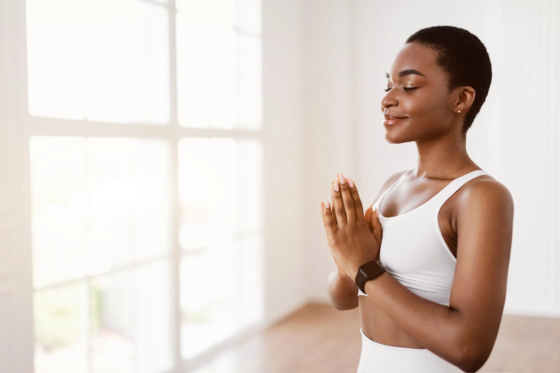 Black woman prayer hands meditating