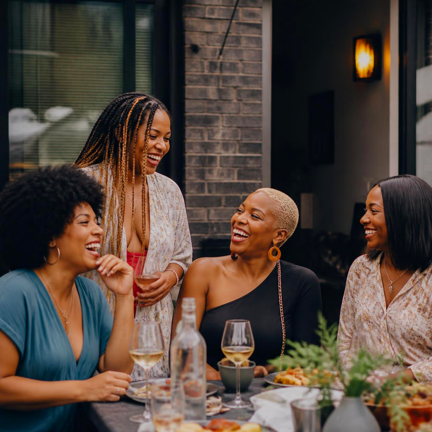 Black women enjoying a meal