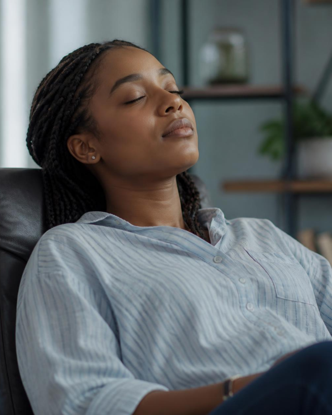 Black woman leaning in chair resting