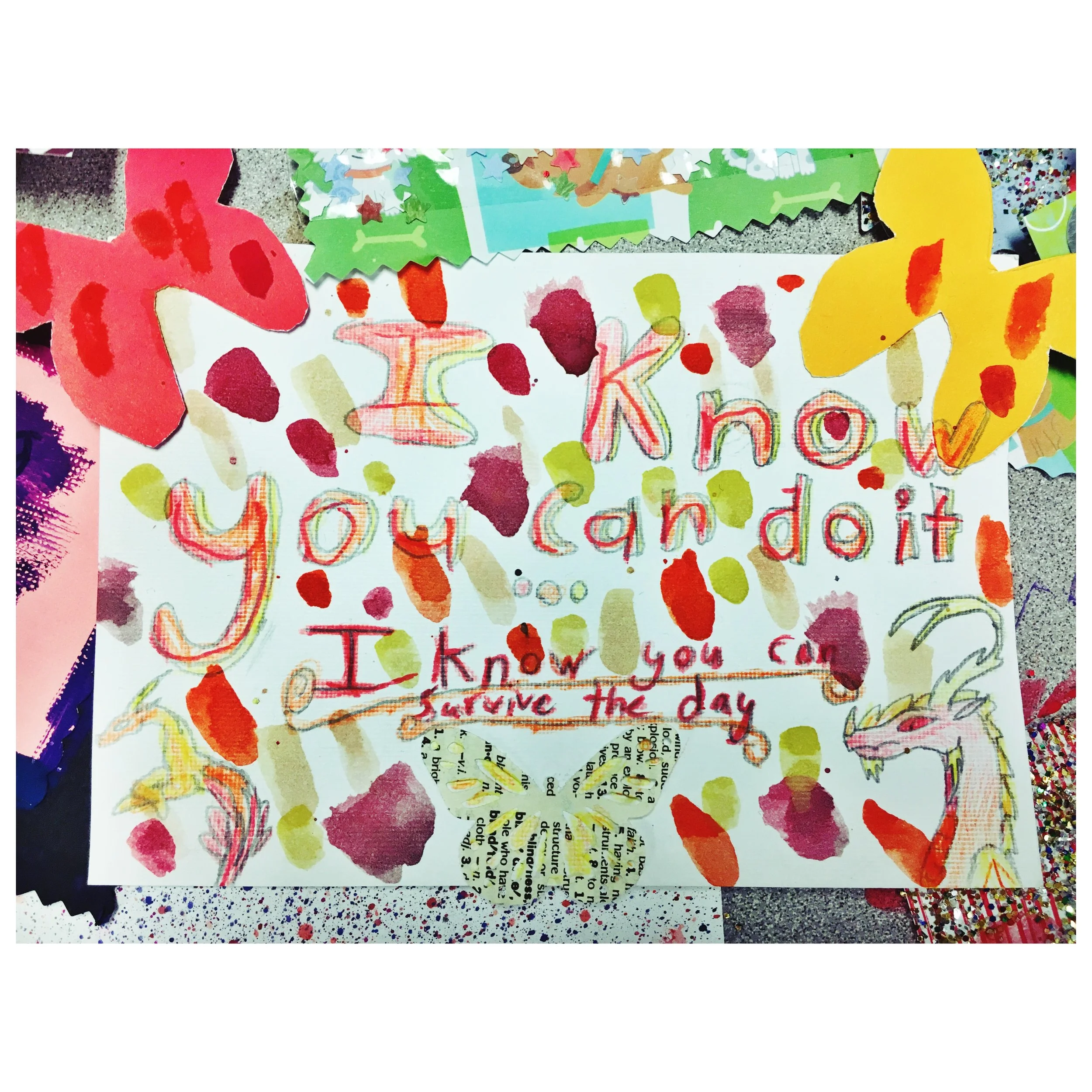 Colorful handmade card with the message 'I know you can't do it, I know you can save the day' written in various colors with drawings of a dragon and decorative elements around it.