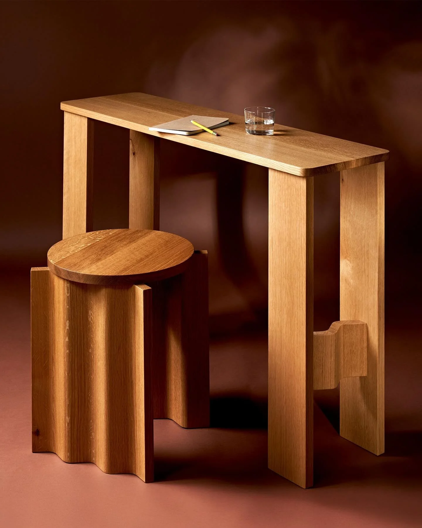 The Corrugated Console Table showing off all her sides. Straitlaced from one perspective and flirtatious from the other&mdash;this playful yet unassuming piece is comfortable in a living room, hallway, or in an office as a slim and elegant desk.

MAD