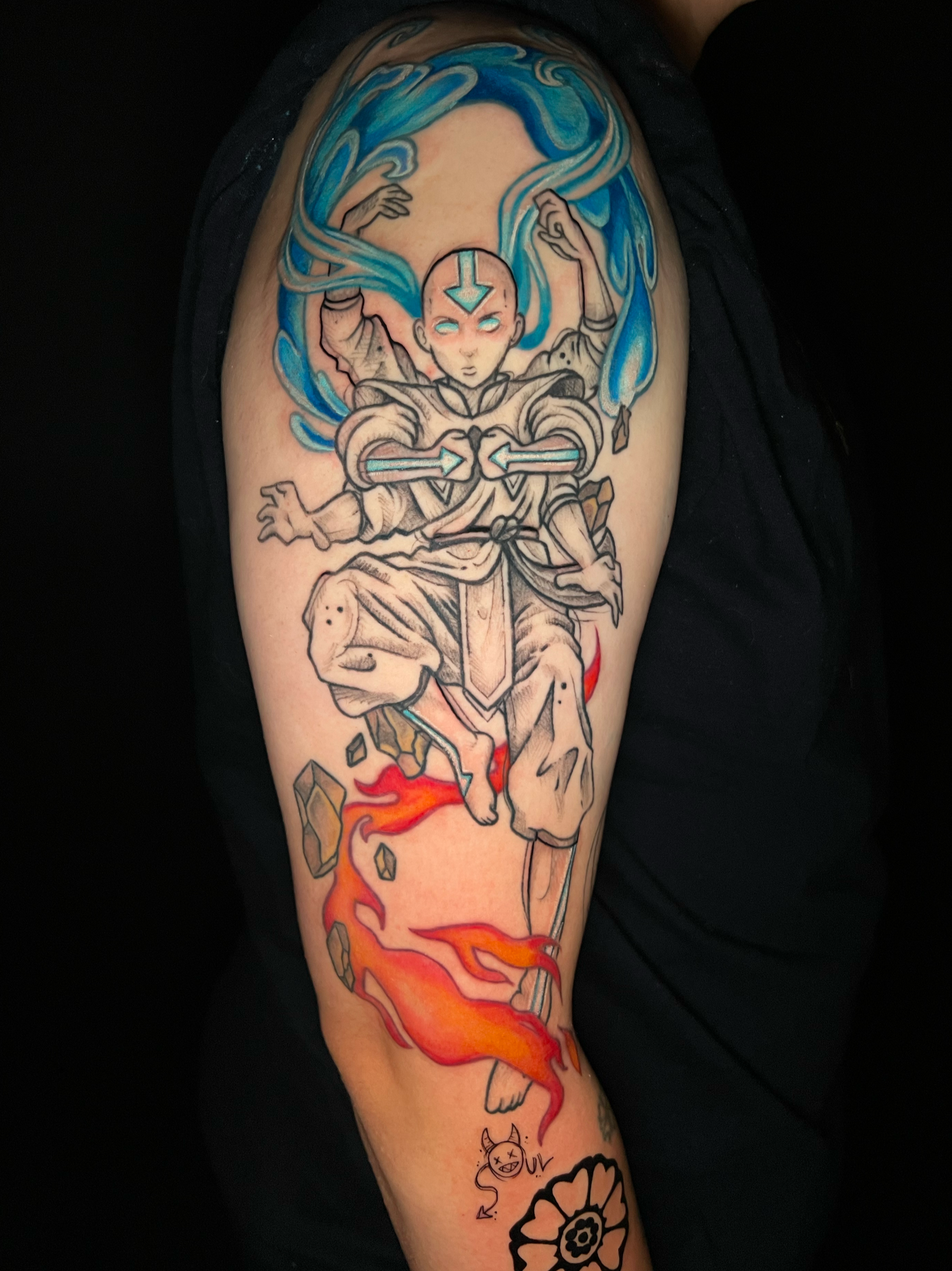 Black and Grey/ Pop of Color Illustrative Tattoo Aang from Avatar. Aang is done in a "sketchy" style, and colors were added in the elements swirling around him (water, earth, fire air). 1/4 sleeve Fanart Bicep Tattoo