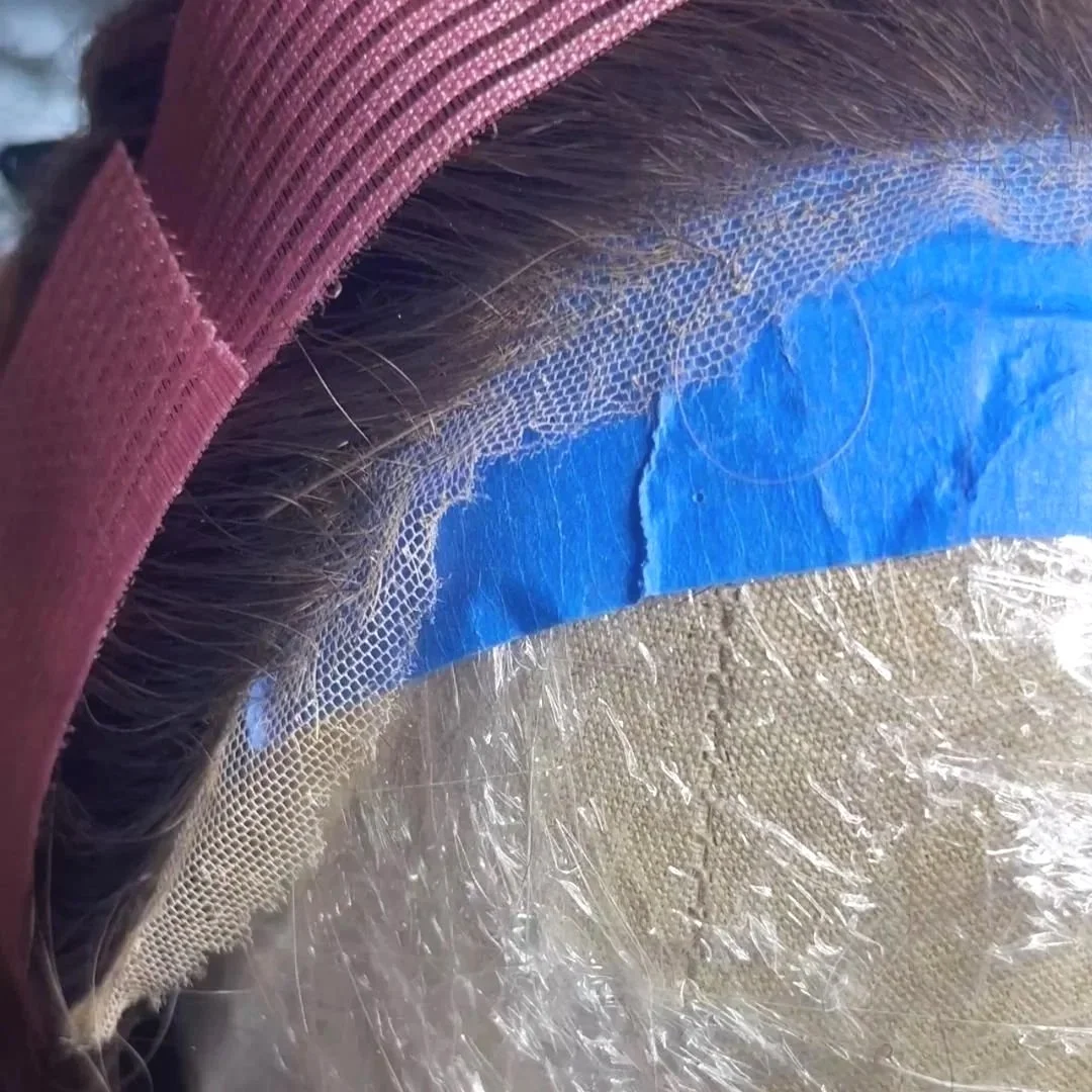 Upclose picture of the front edge of wig lace that is stitched and rippling