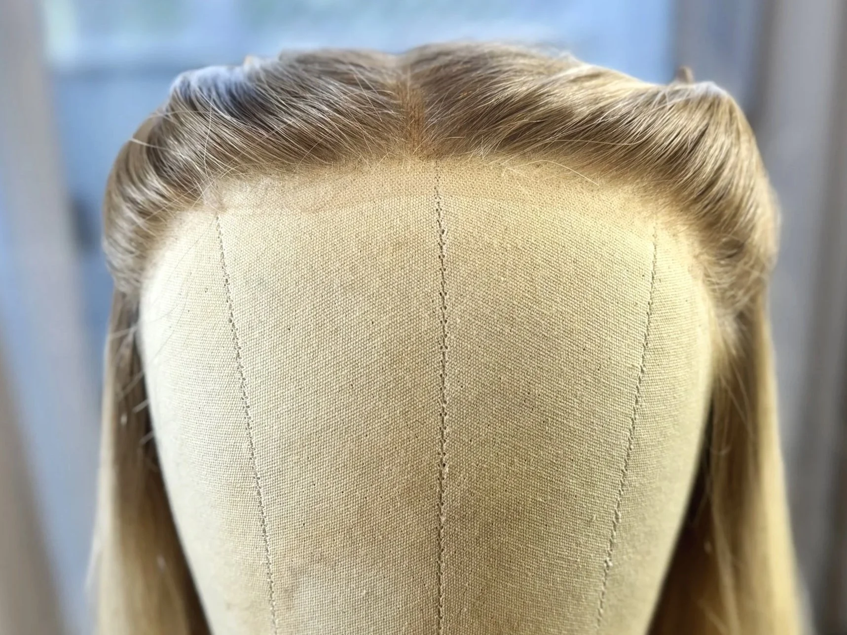 Front view of a lace front wig with a snug fitting lace after an alteration was completed
