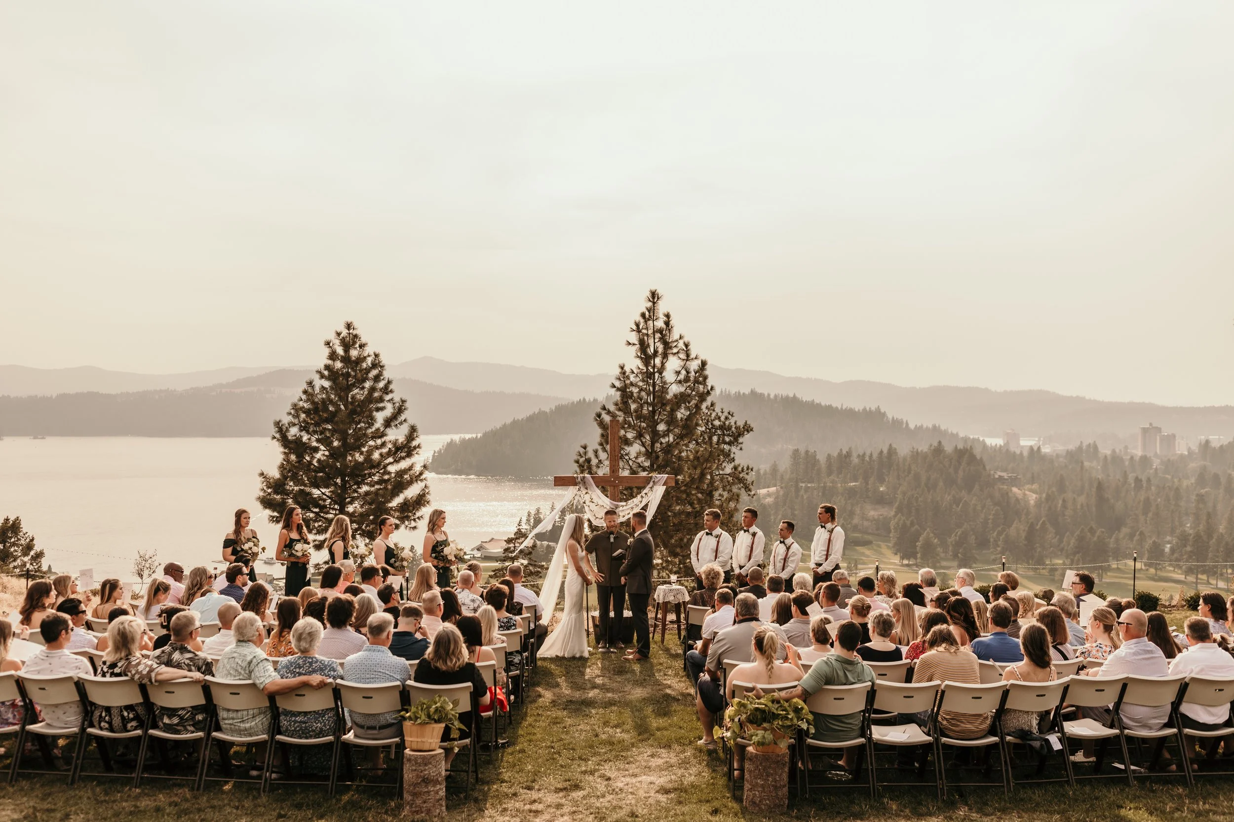 Wooden cross arbor at a lakefront wedding ceremony near Coeur d'Alene, Idaho
