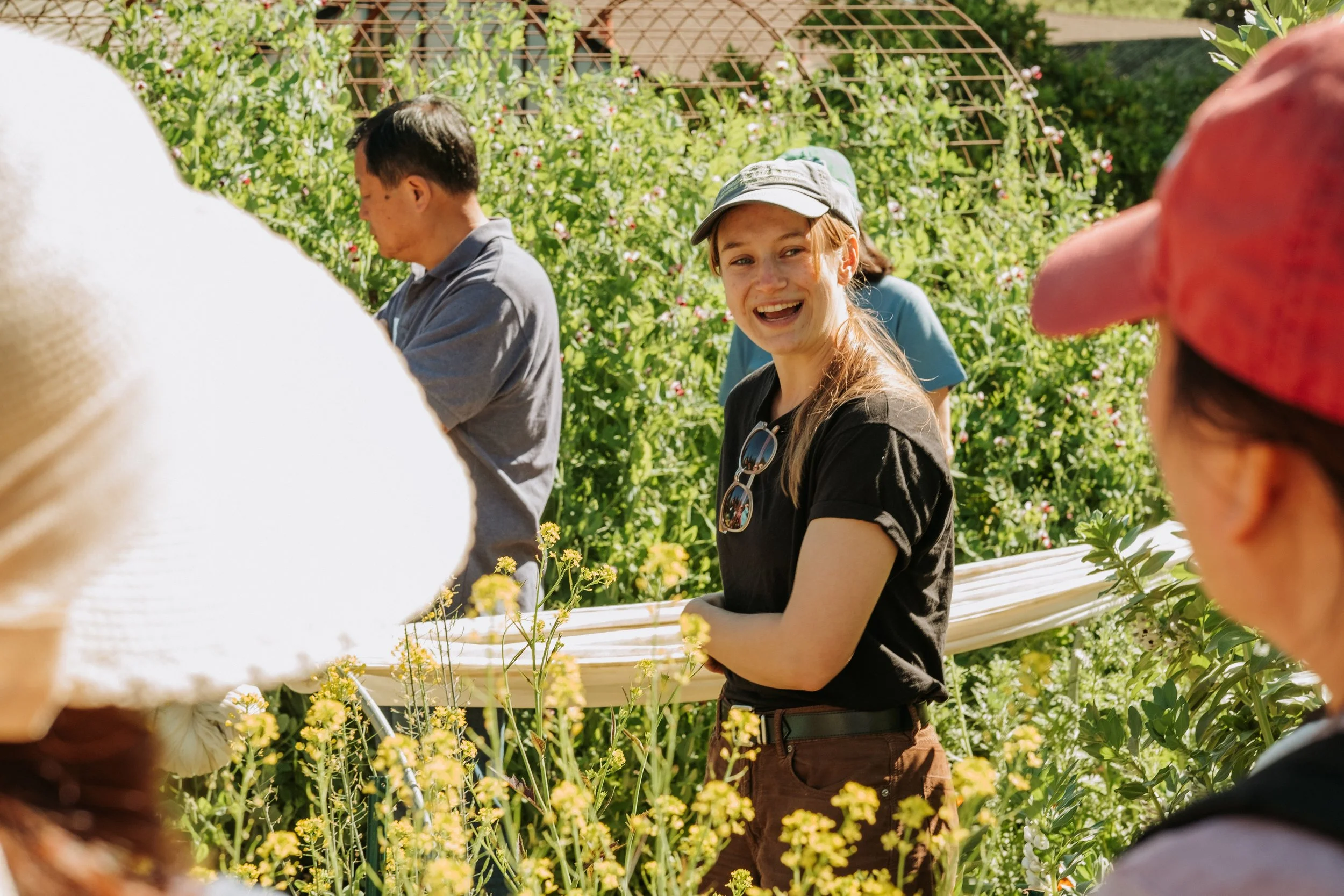 Horticulture Staff, Grace Floyd, leading a walk-through of the Edible Garden Beds