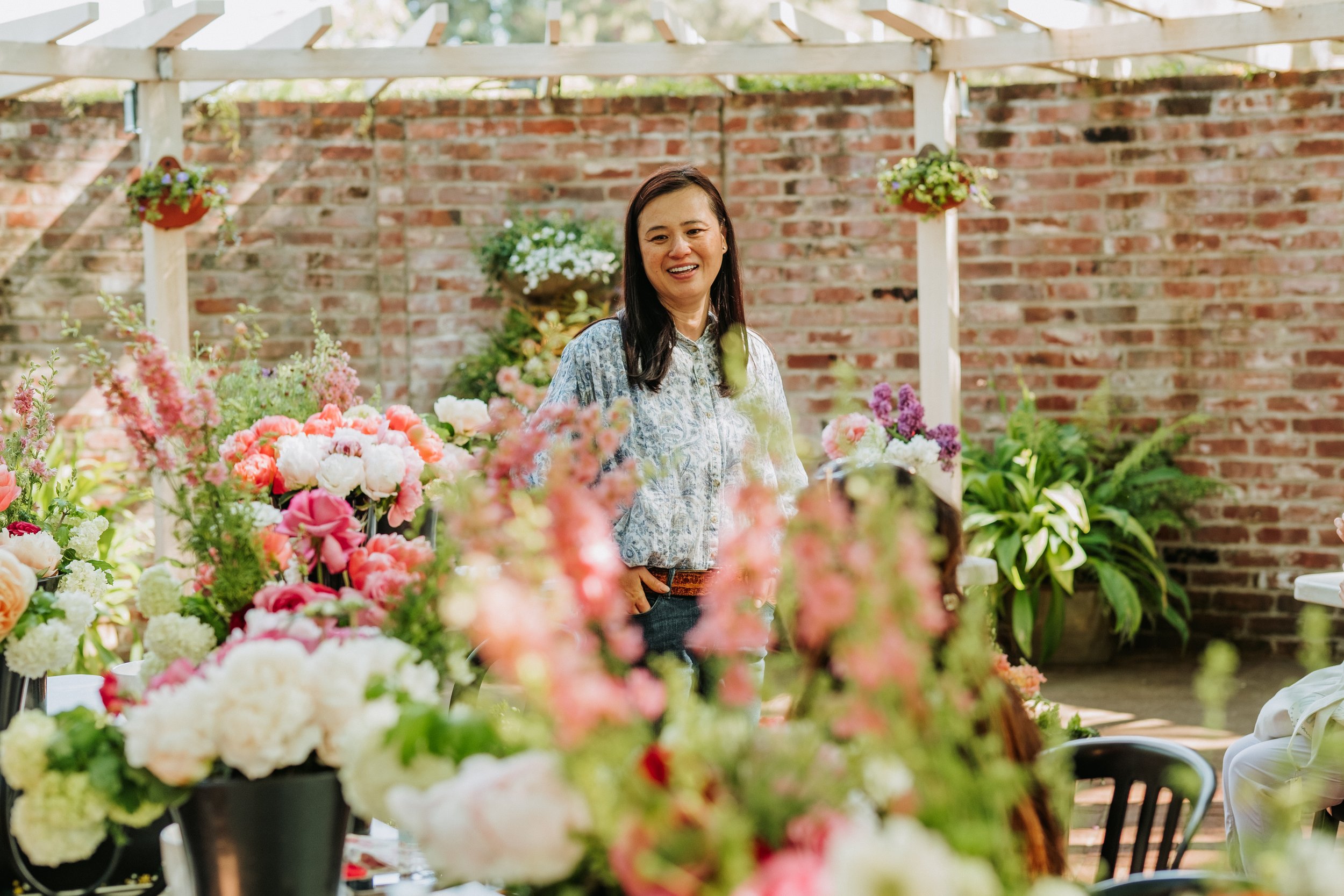 Class instructor, Jacqueline Pham, of Phamily Peony Garden, leading a peony arranging class