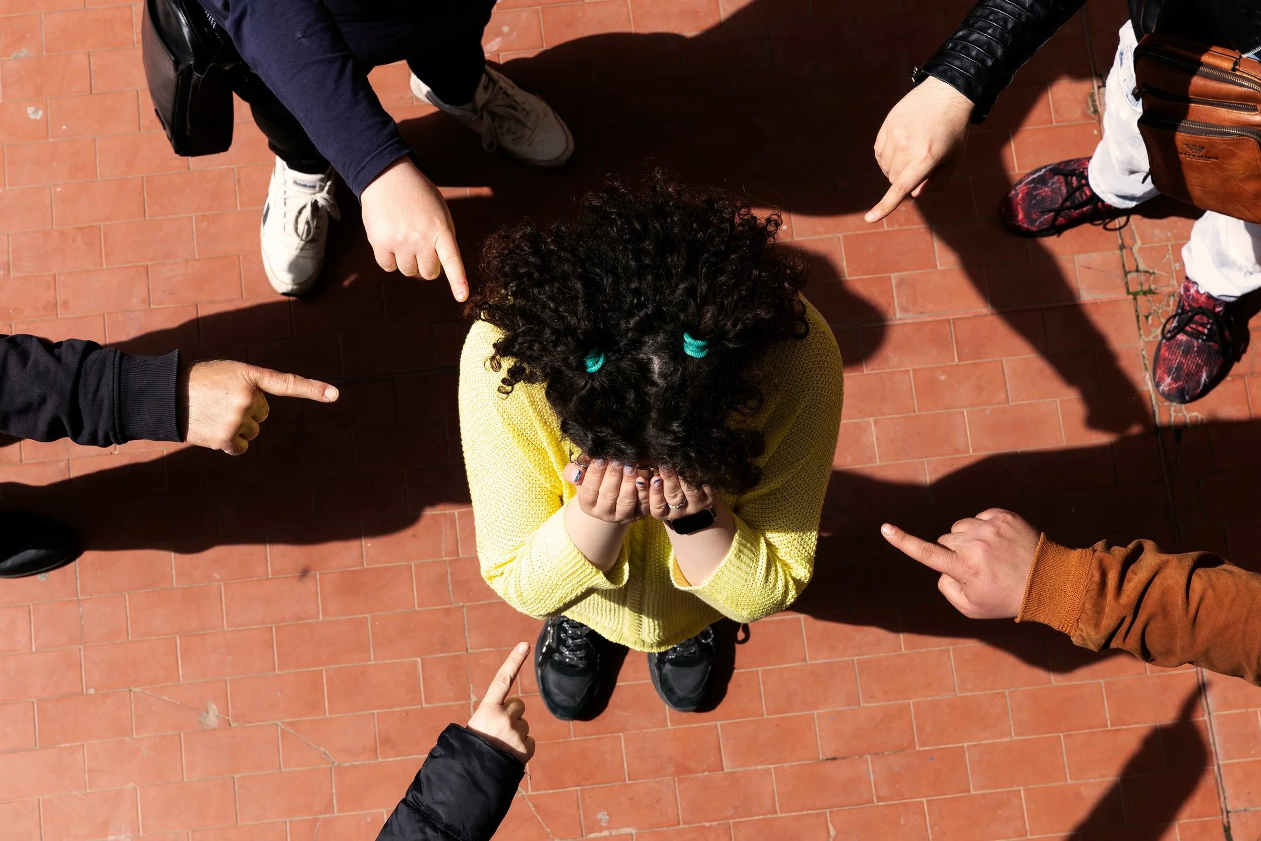 Child suffering from bullying, having lasting effects on emotional well-being, affects mental health, child ostracised