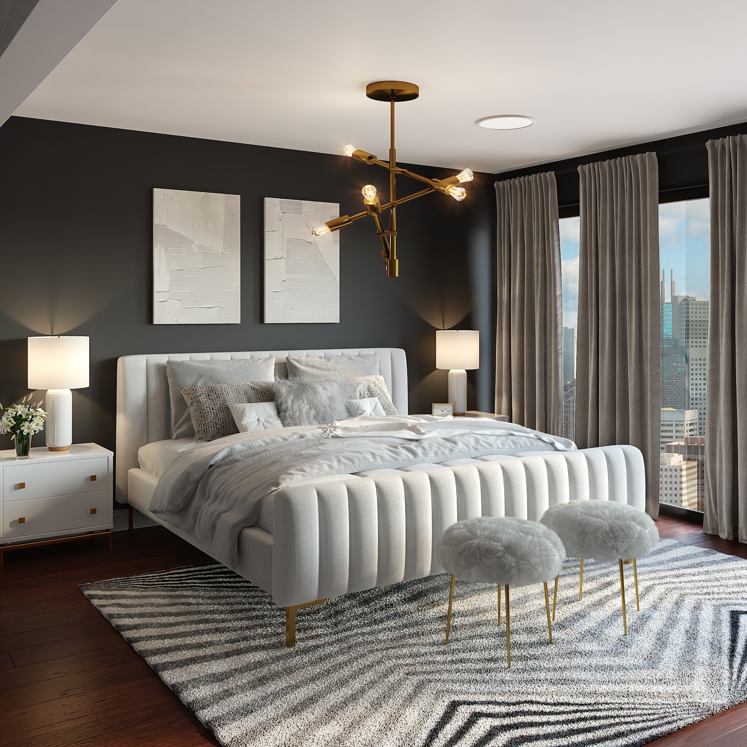 Modern bedroom with a gray upholstered bed, fluffy pillows, and a striped rug. Two bedside tables with lamps, abstract wall art, and a contemporary chandelier. Large windows with gray curtains overlook a cityscape.