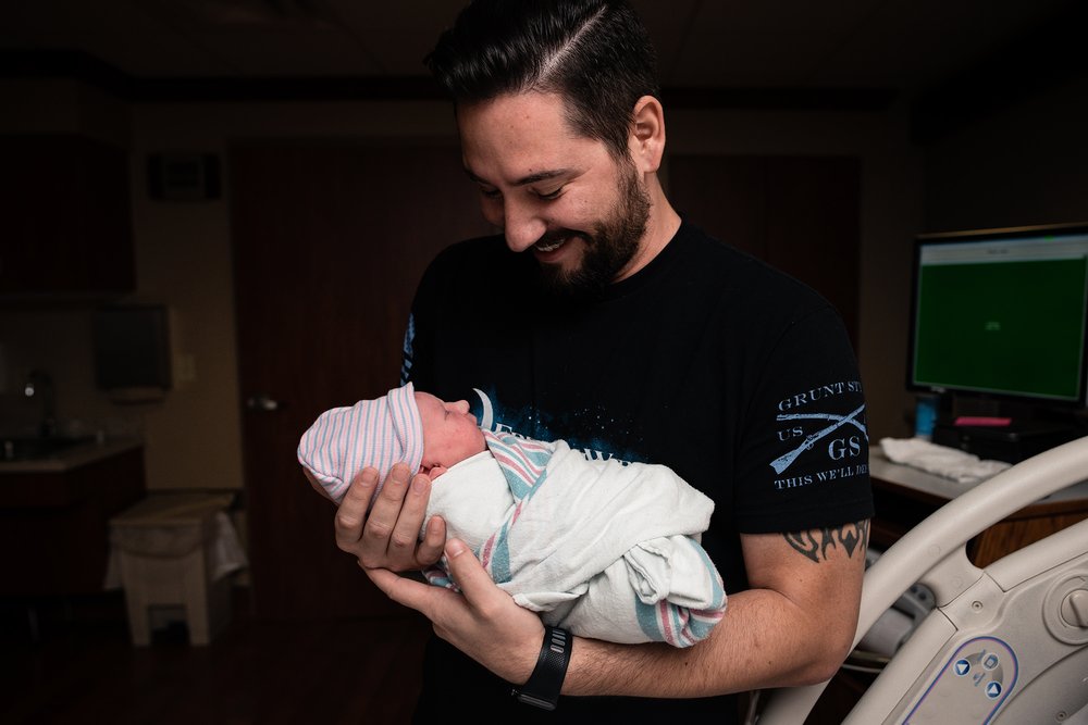 23 dad holding daughter for the first time austin photography.jpg